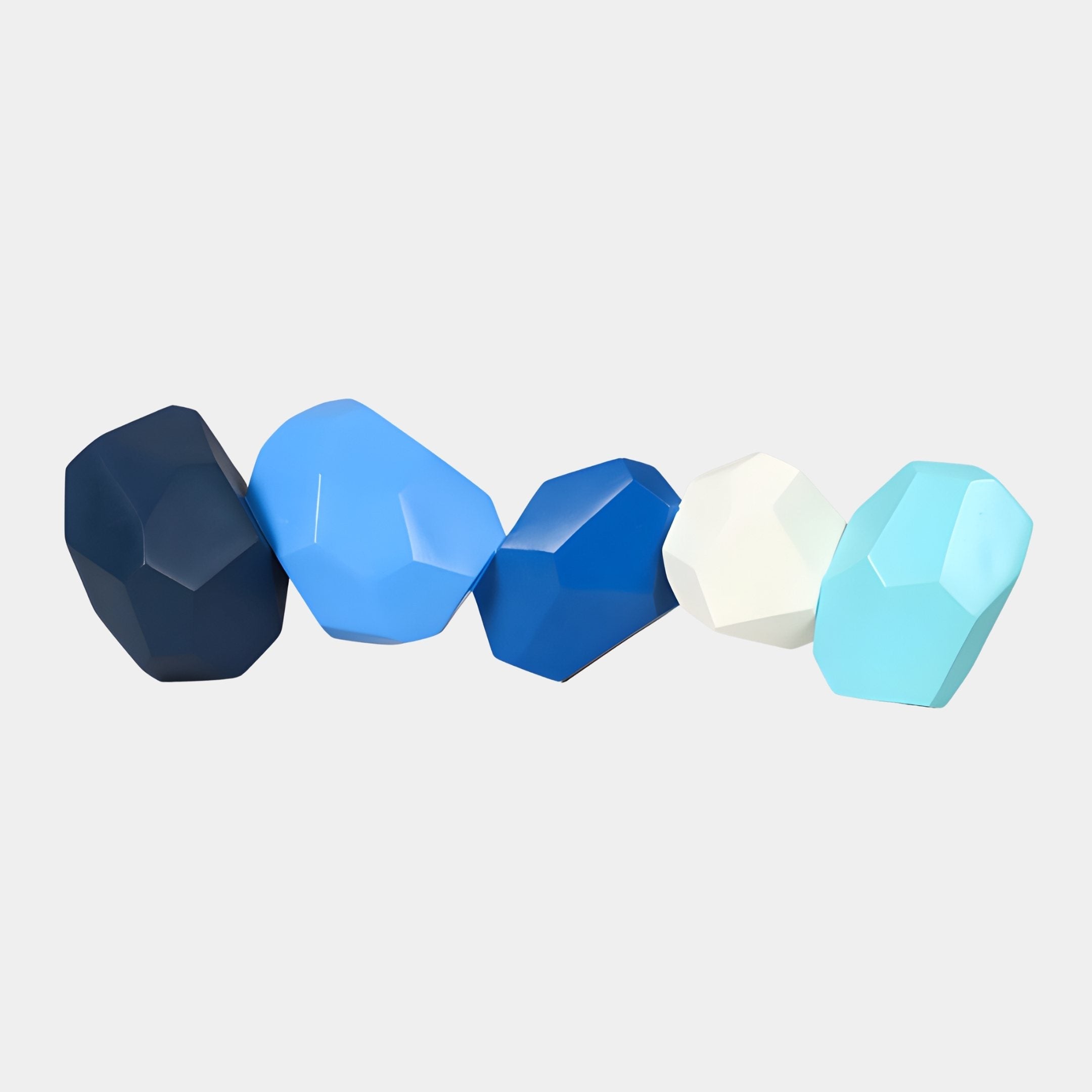 Giant Sculptures Geo Boulder Blue Abstract Resin Sculpture Set in navy, sky blue, royal blue, off-white, and mint, arranged in a row on a plain background.