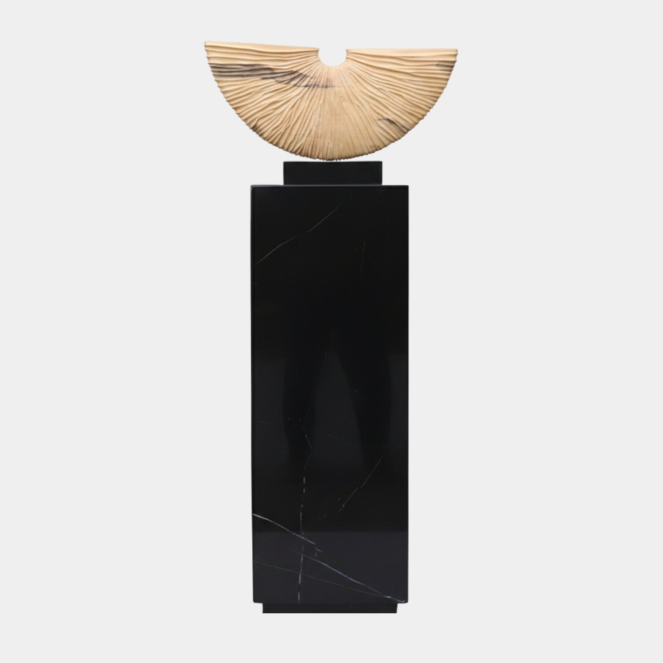 Crescent Natural Wood On Black Marble Plinth 146cm by Giant Sculptures, a hand-carved pale wood fan with radiating rays atop a tall black marble base.