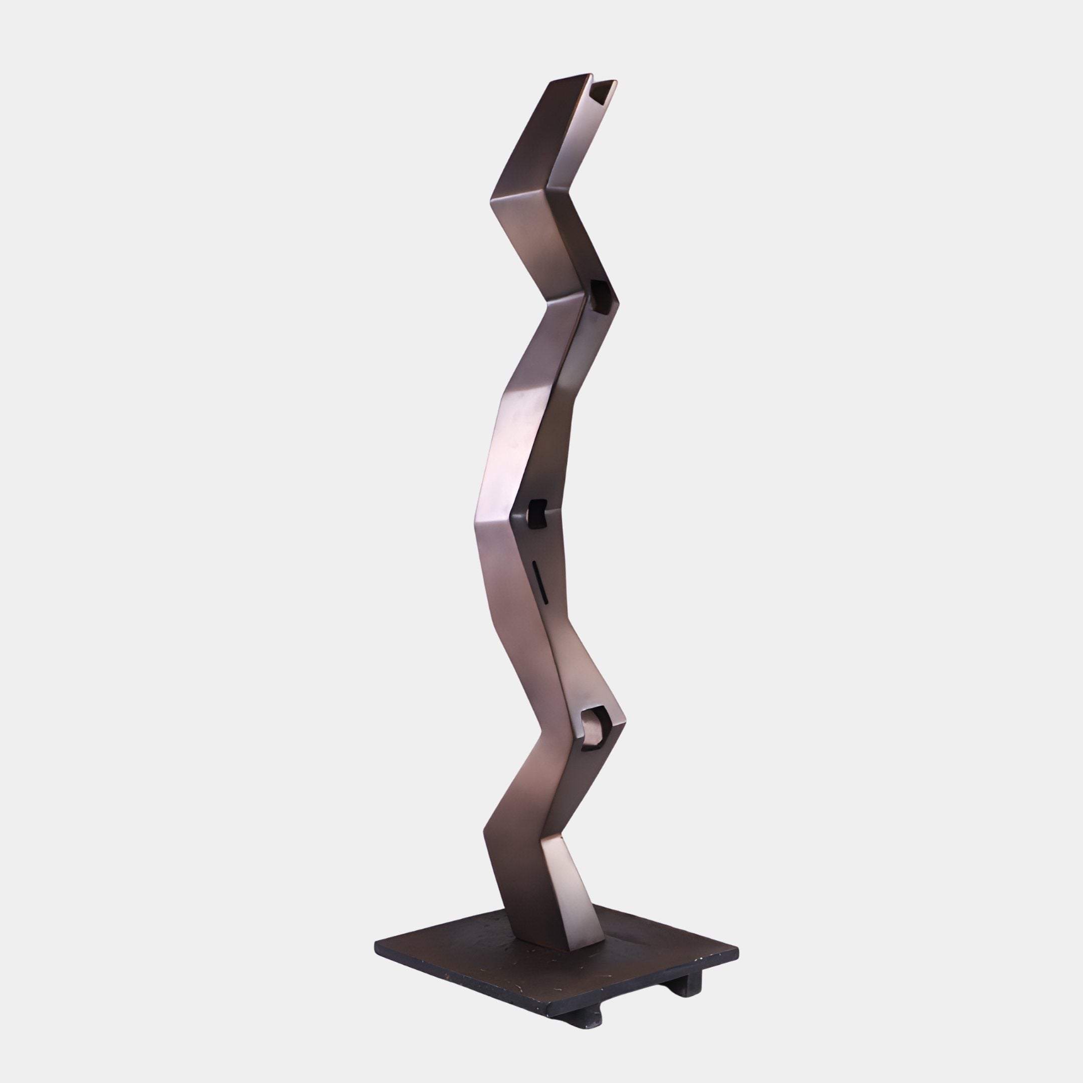 Bronze Zigzag Abstract Wood Sculpture by Giant Sculptures, a 136cm vertical zigzag column with square apertures at each fold, on a dark base plate.