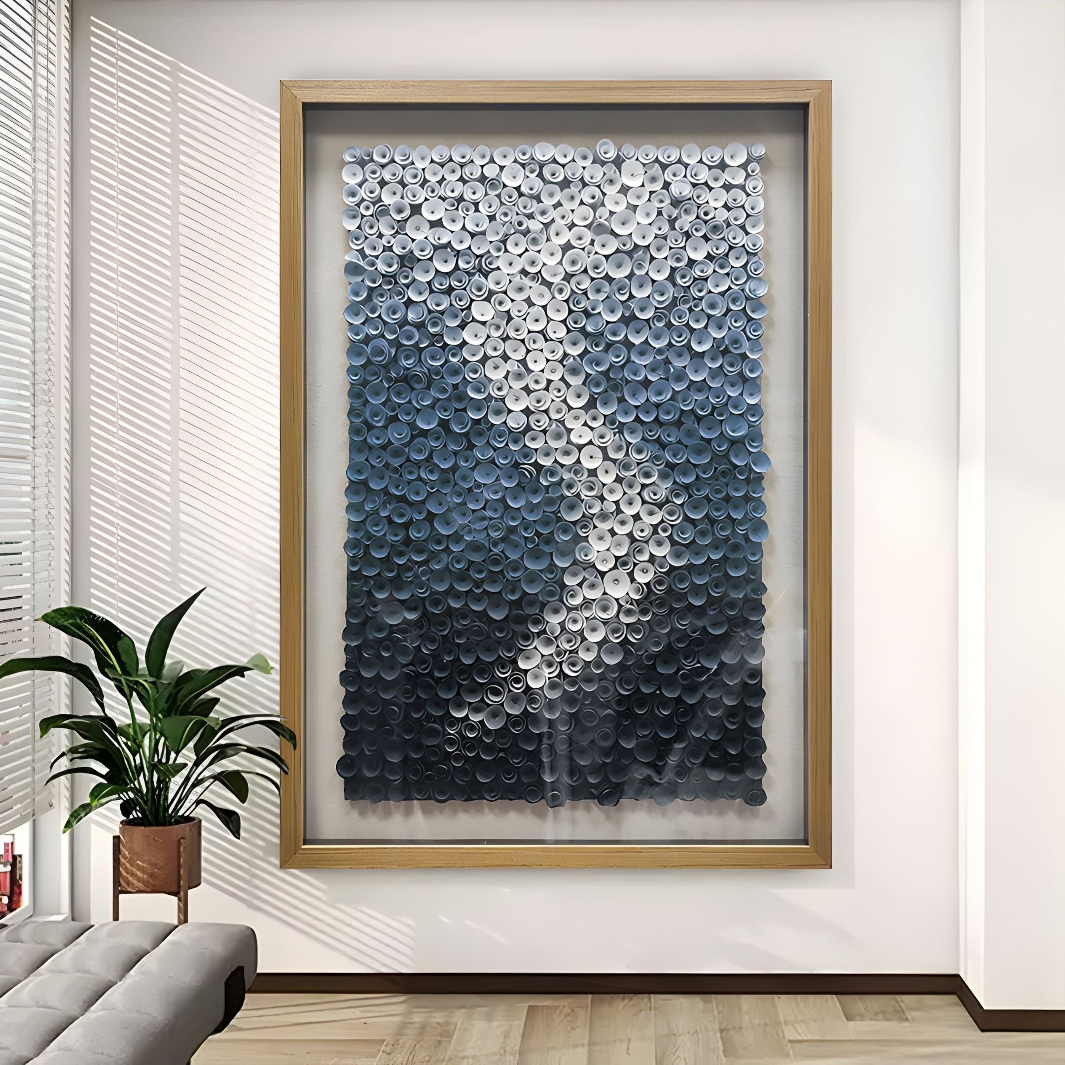 The Spiravale Blue Gradient Floral Curl 3D Wall Art by Giant Sculptures features layered discs in white, gray, and blue, creating a wave-like design ideal for modern spaces with natural light and minimalist décor.