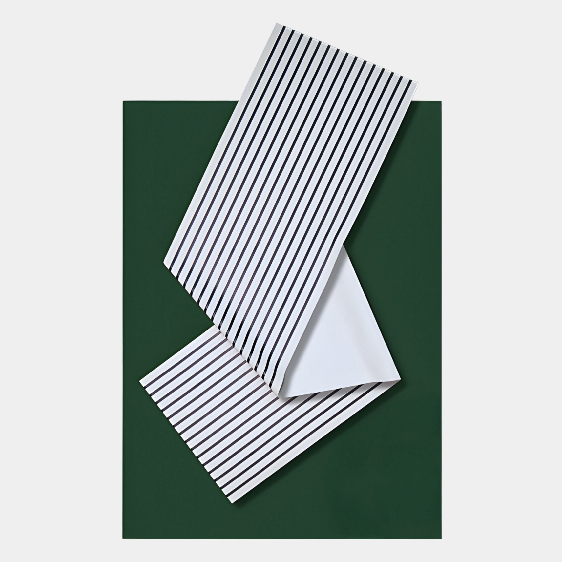 The Arcluma Forest Green Stripe Fold Leather 3D Wall Art by Giant Sculptures features two folded white sheets with black vertical stripes on a dark green background, creating bold, modern wall decor for any space.