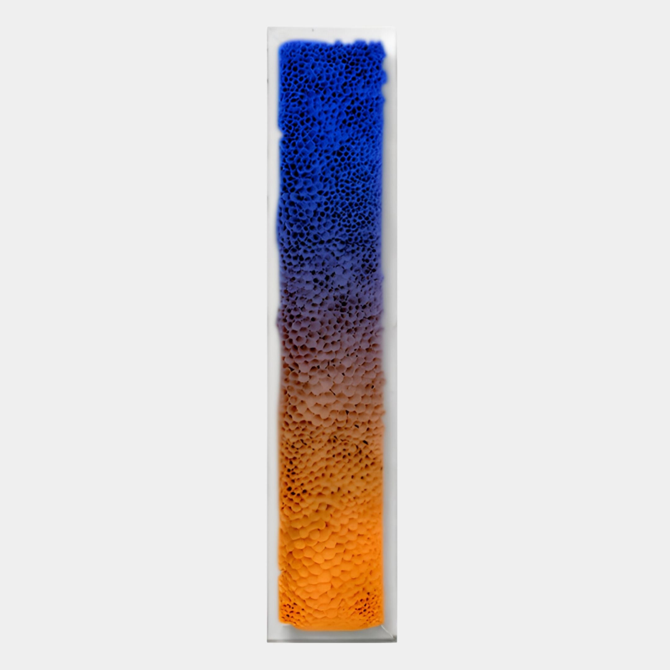 The Aeraline Sunset Blue Vertical Gradient Leather 3D Wall Art by Giant Sculptures features a tall, textured surface with raised bubbles and a gradient fading from deep blue to orange through purple on a light gray background.