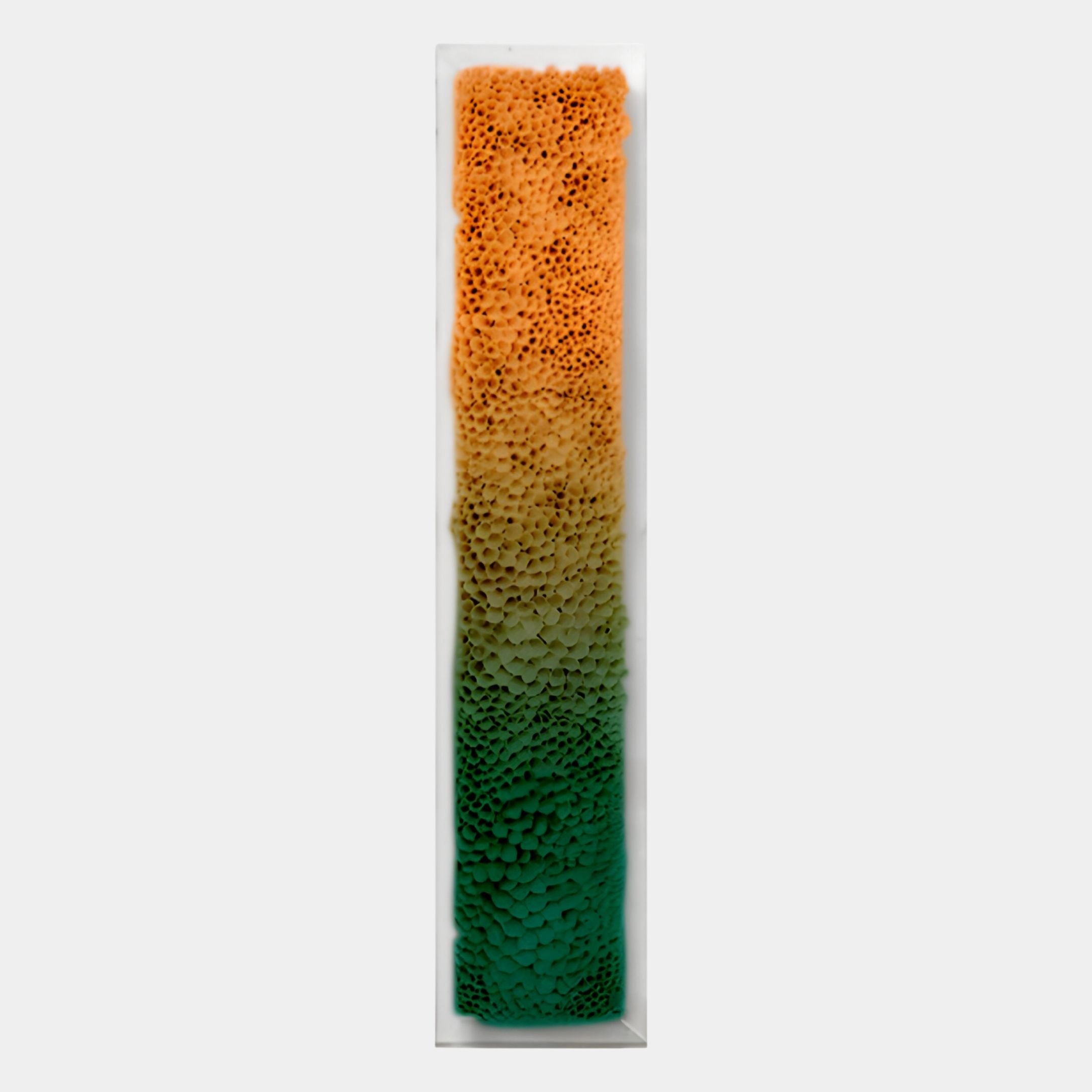 The Aeraline Amber Green Vertical Gradient Leather 3D Wall Art by Giant Sculptures features a tall, narrow block with a textured surface and orange-to-green gradient, making it striking contemporary art against a plain white background.