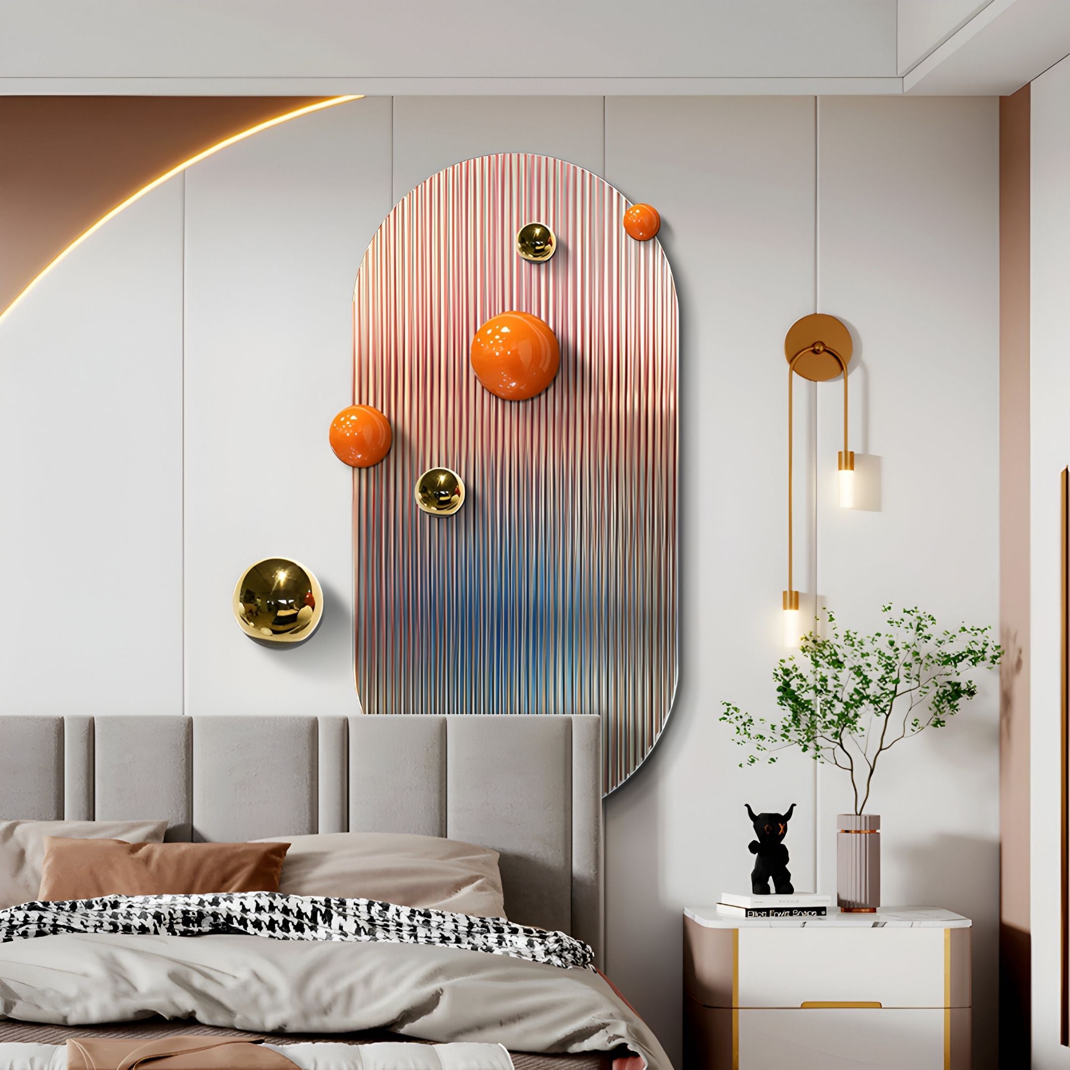 A modern bedroom features a gray upholstered bed, a nightstand with a vase and black dog figurine, and the Virellon Rose Gradient 3D Wall Art With Gold & Orange Metal Balls by Giant Sculptures. A gold wall lamp and pendant complete the look.