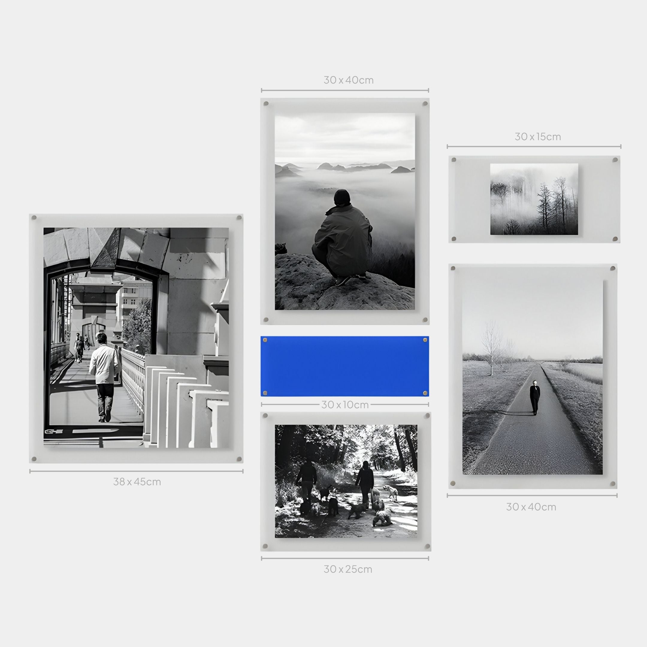 The Framegrid Blue Mixed-Size Gallery 6-Set Acrylic Wall Art by Giant Sculptures features six framed landscape and portrait prints, each labeled with dimensions, arranged in a modern, asymmetrical grid with one bold blue panel for a stylish interior accent.