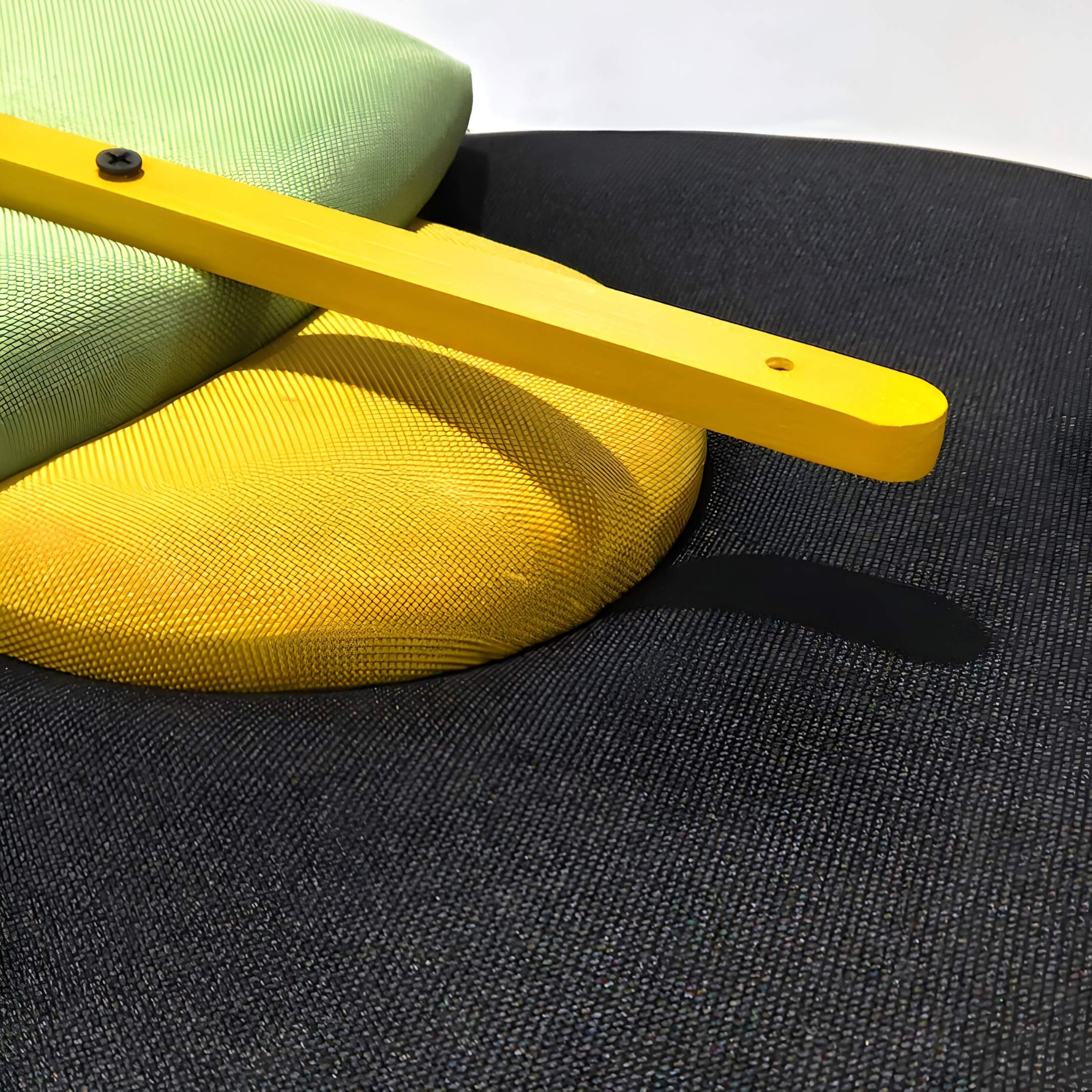 Close-up of Solvia Green & Yellow Layered Geometry 3D Wall Art by Giant Sculptures, featuring a textured surface with round yellow and light green cushions plus a bright yellow wooden bar—an eye-catching piece of contemporary decor.