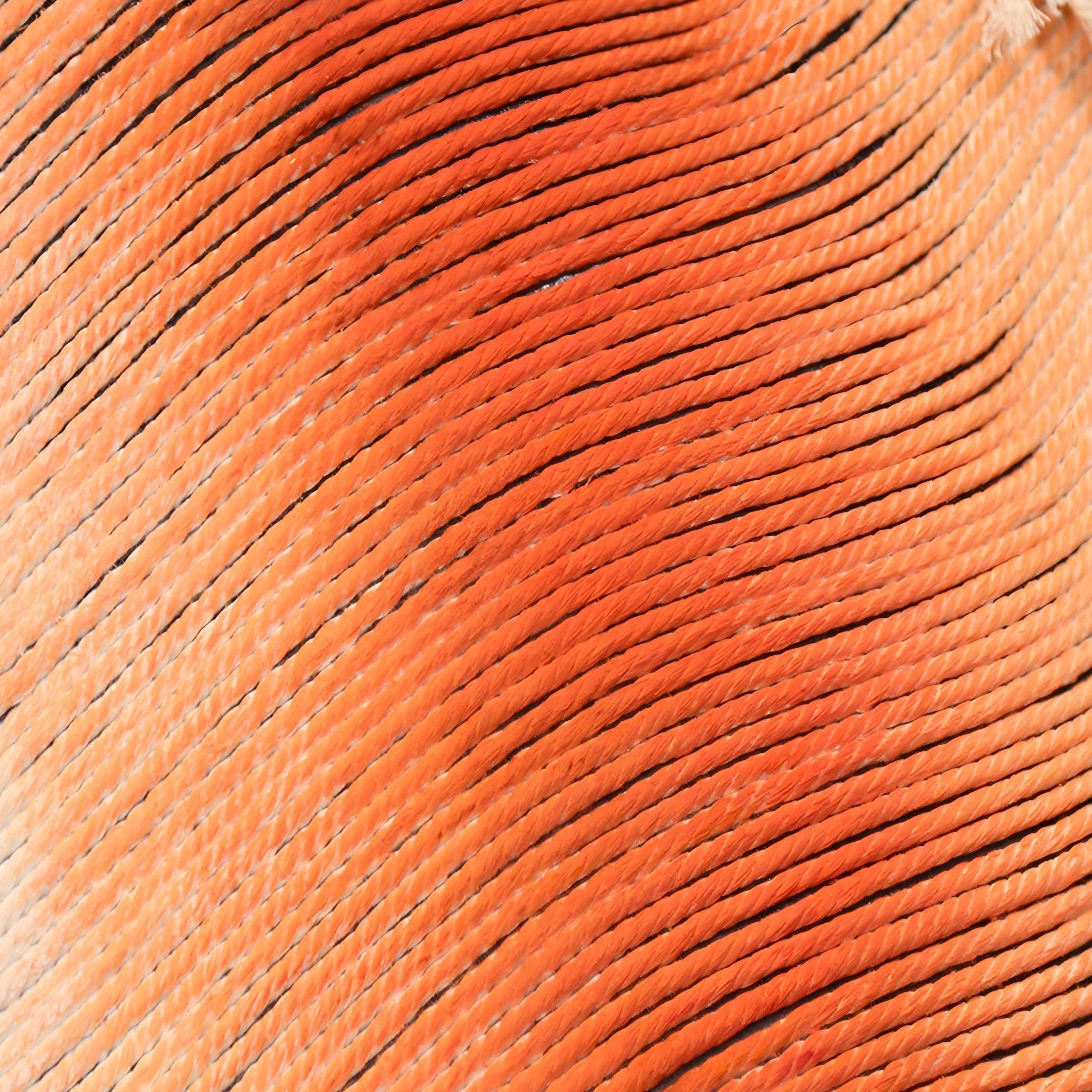 Close-up of vibrant orange and black textures in the Rivara Ember Wave Vertical Hand-Painted Rope 3D Wall Art by Giant Sculptures—an inspiring choice for contemporary interiors or statement wall displays.
