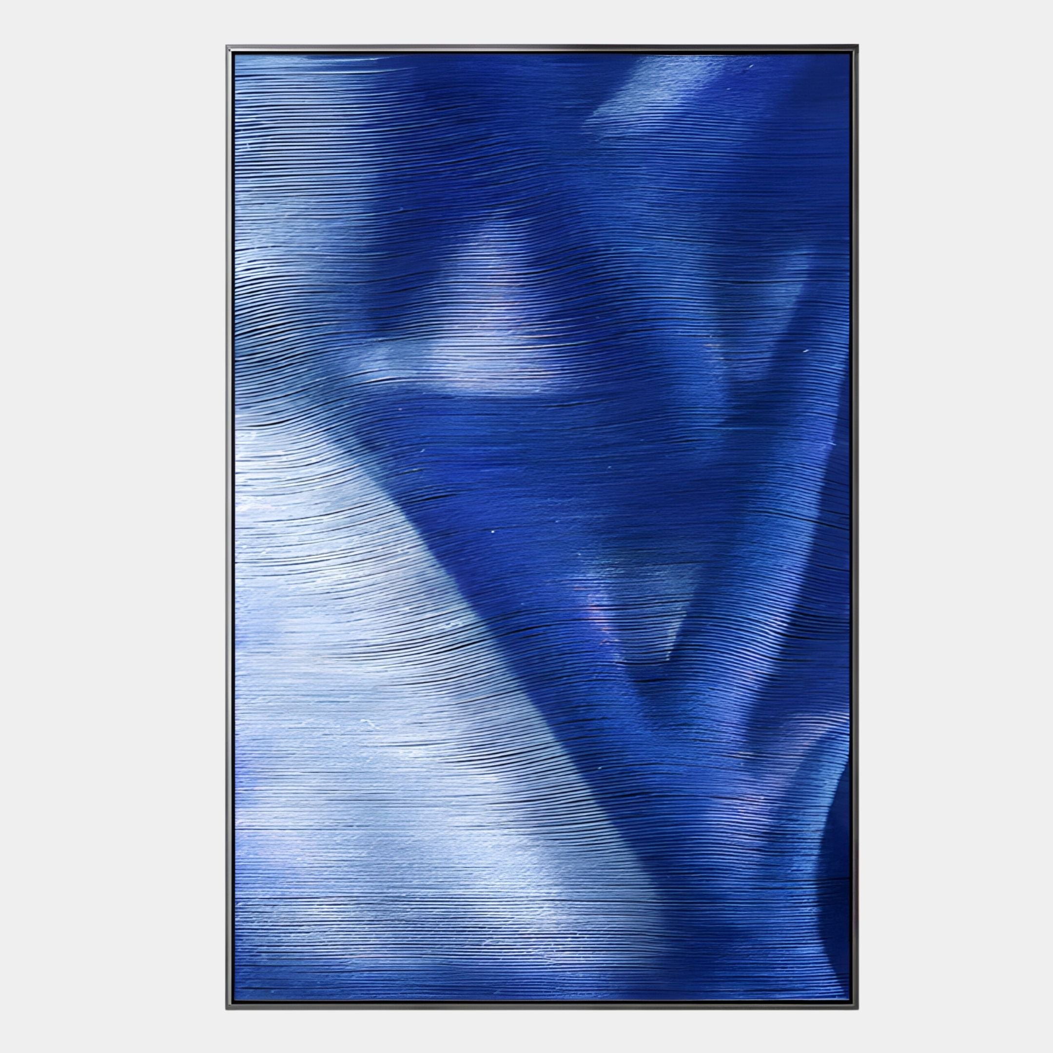 The Rivara Cobalt Flow Hand-Painted Rope 3D Wall Art by Giant Sculptures features textured blue and white wavy lines, evoking the look of tree branches or flowing water in varied cobalt shades.