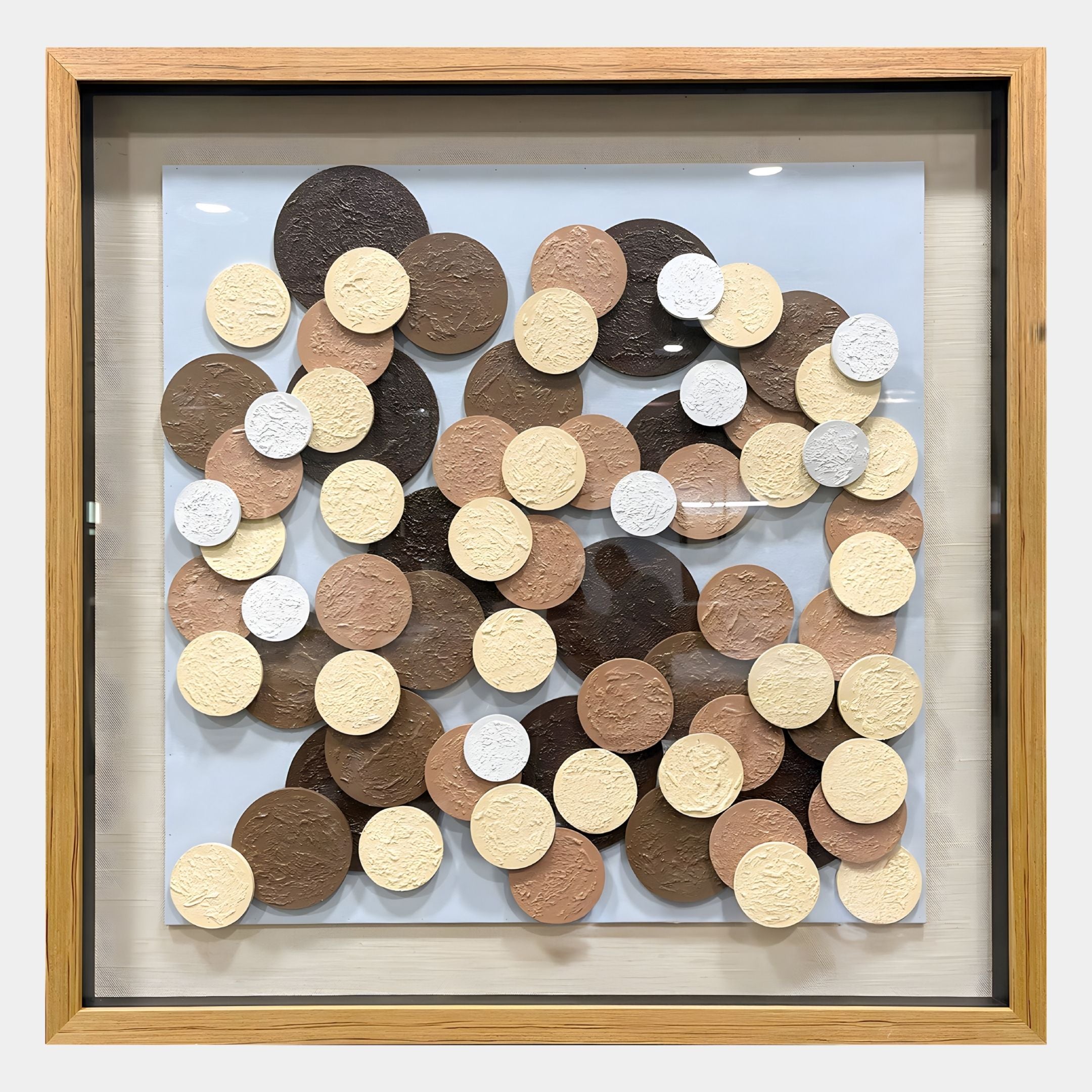 The Circona Neutral Tone Layered Disc Wood 3D Wall Art by Giant Sculptures showcases textured, overlapping discs in brown, cream, beige, and white on a light backdrop.