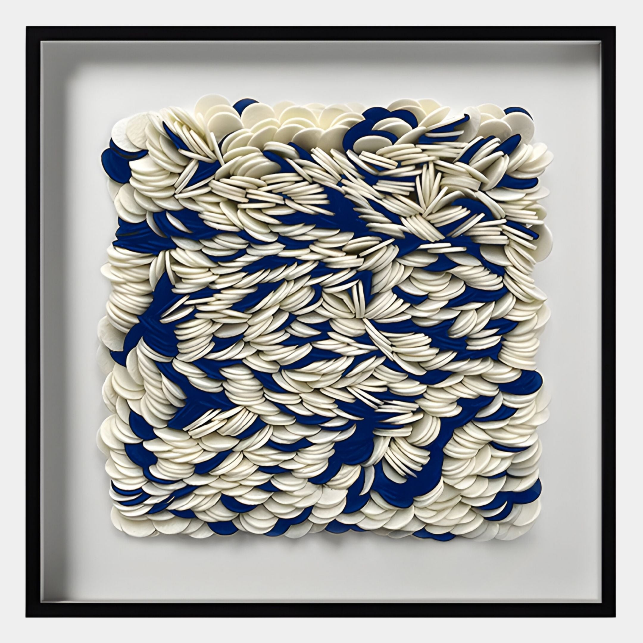 The Giant Sculptures Petalus Blue & Cream Layered Felt 3D Wall Art features densely arranged overlapping white and blue circular shapes in a square frame, ideal for adding modern style to contemporary interiors.