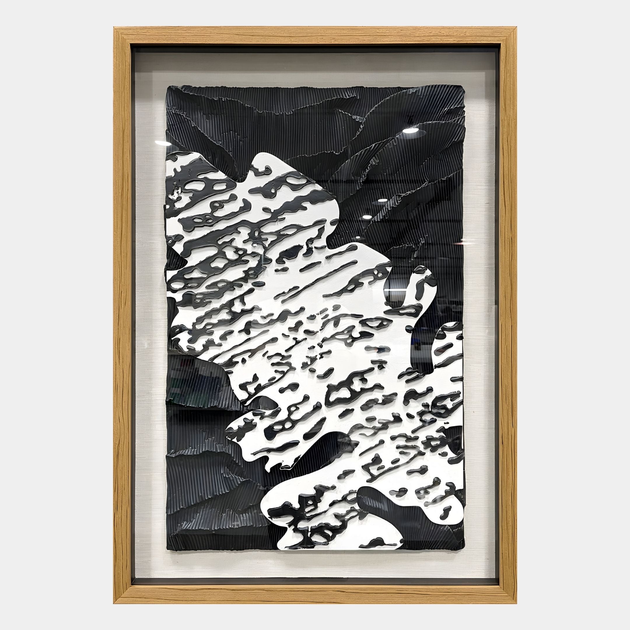 The Vanterra I Black & White Flow Framed 3D Wall Art by Giant Sculptures features layered textures and organic ripple patterns, creating a bold black-and-white contrast that’s perfect for elevating any modern interior.