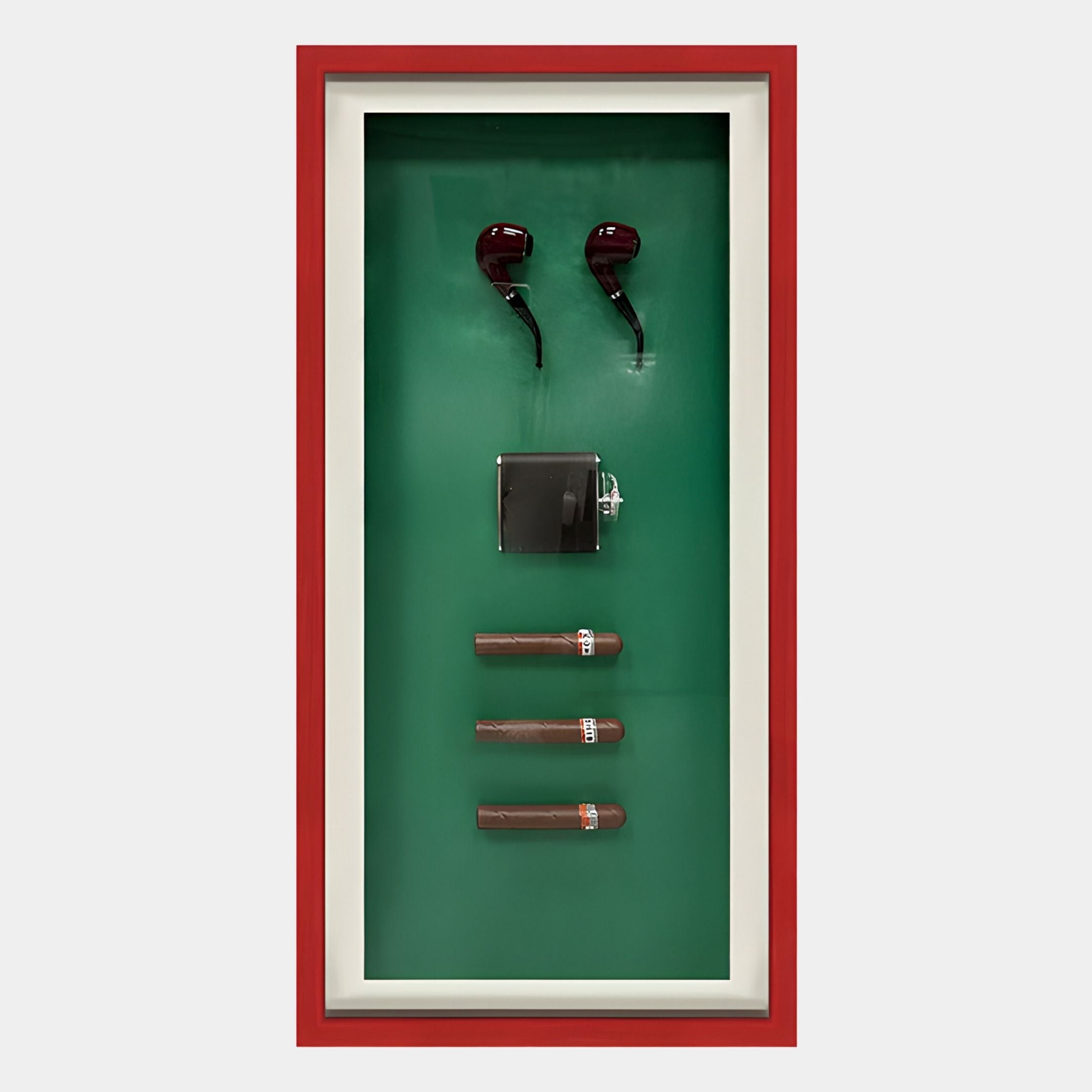 The Cavendor Pipe & Cigar Green Framed Wall Art by Giant Sculptures features two pipe-shaped objects, a metal flask, and three vertical cigars with a red border against a vivid green background.