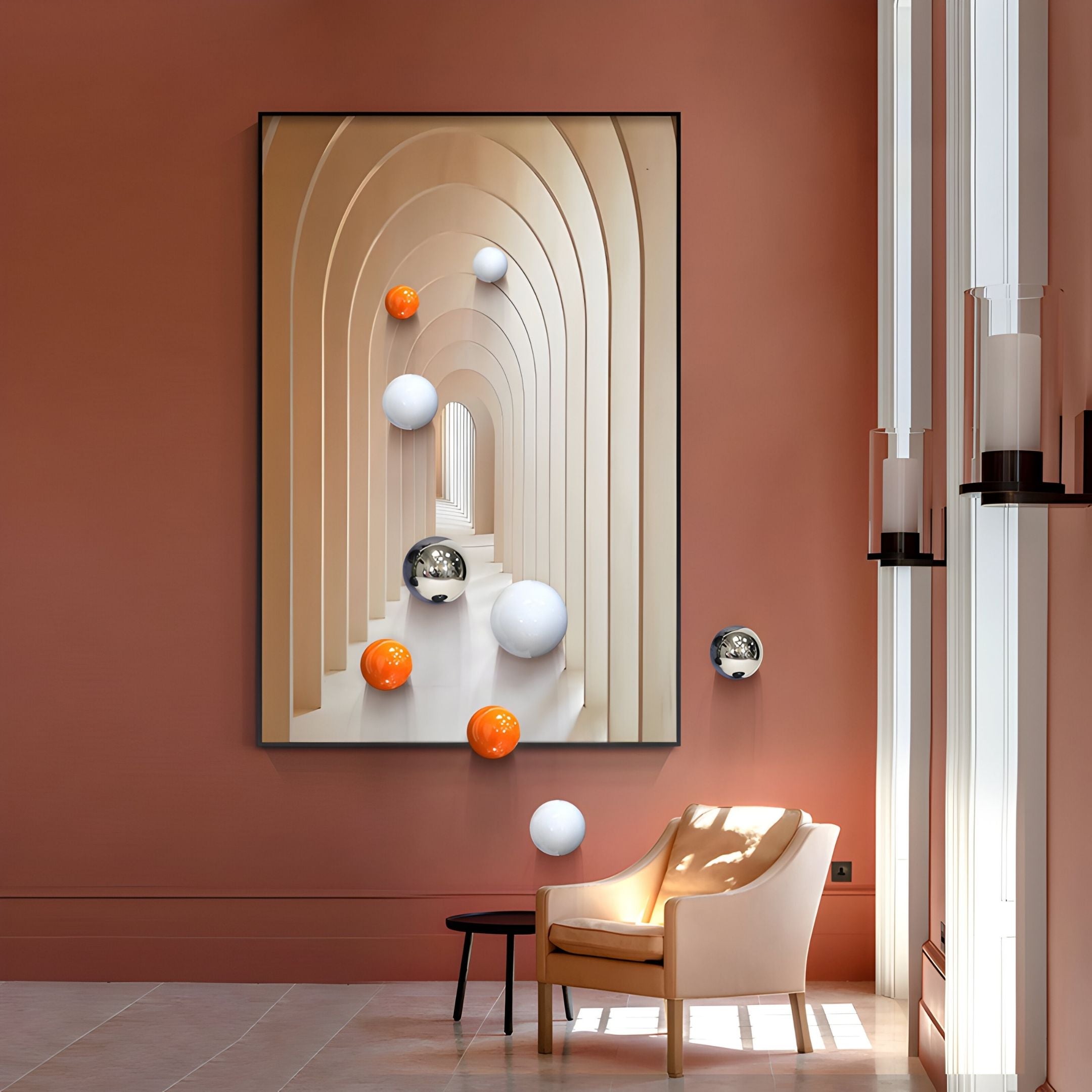 A modern room with terracotta walls features the Vaultis Ivory & Sand Archway 3D Wall Art With Metal Balls by Giant Sculptures, a beige armchair, a small dark table, and tall windows that flood the space with natural light.