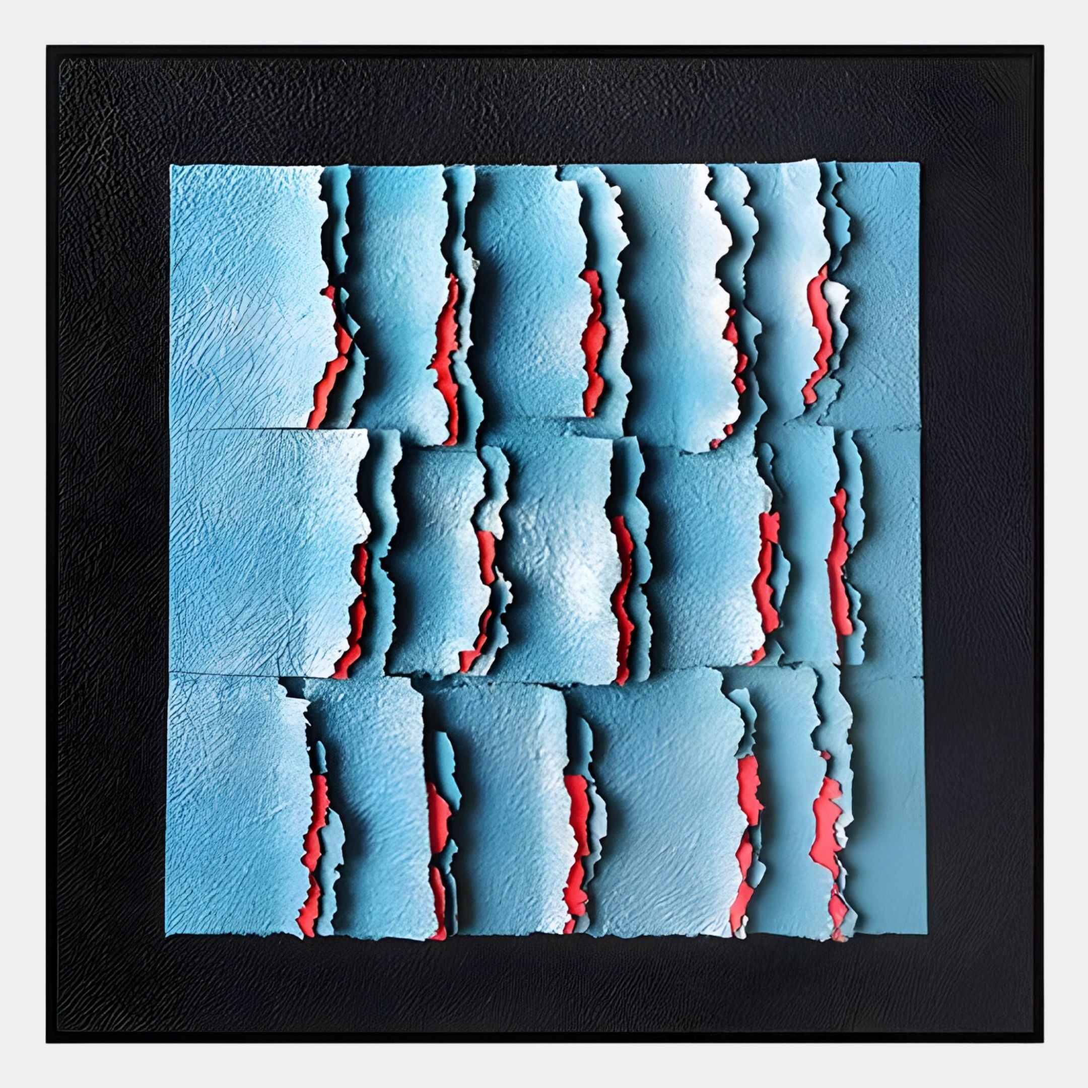 The Rivura Blue Layered Sandstone Texture 3D Wall Art by Giant Sculptures features modern abstract blue panels with jagged, torn edges revealing bright red beneath, set in a black frame and arranged in a grid pattern.
