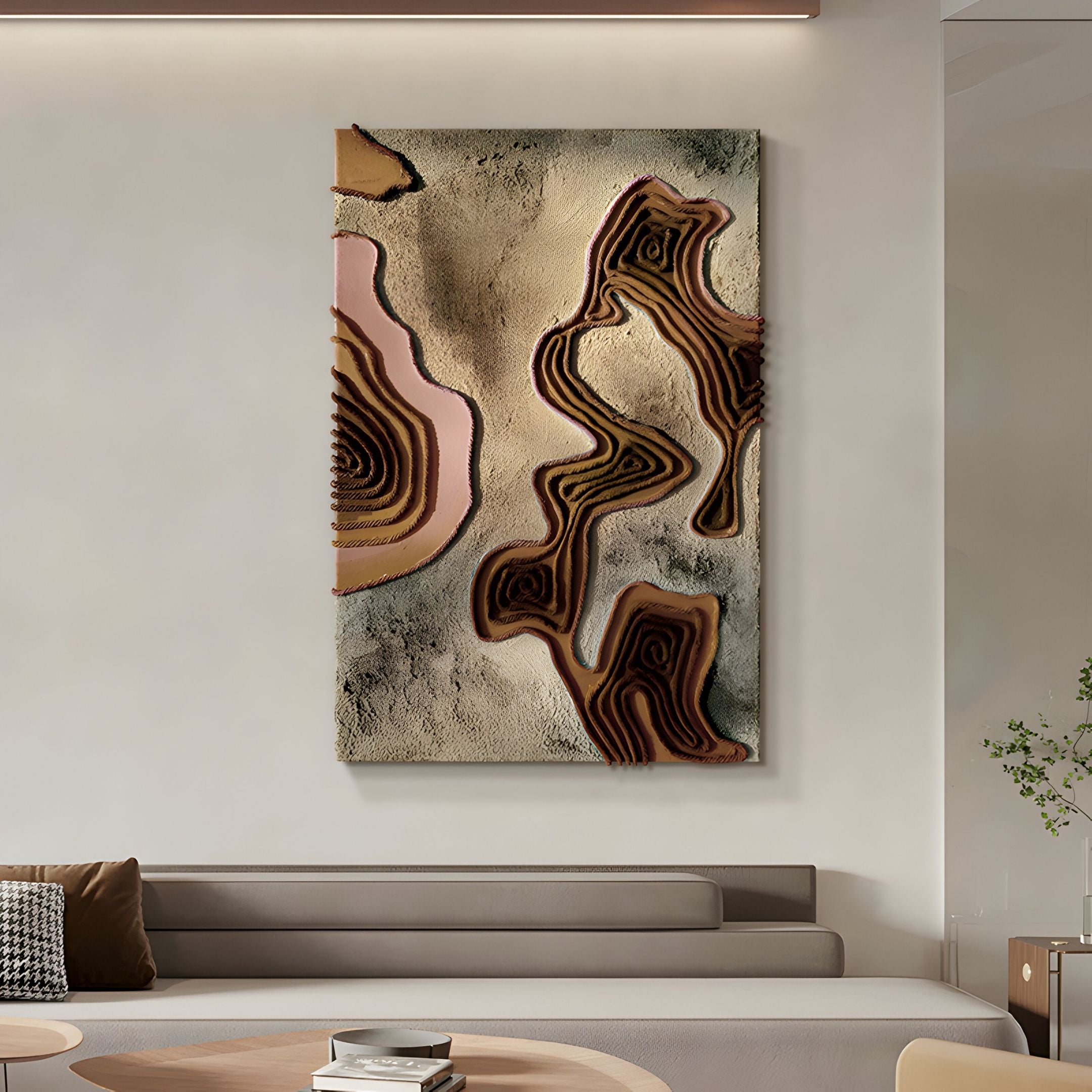 The Terracore Earth Brown Contour Relief Abstract 3D Wall Art by Giant Sculptures features wavy layers in earthy brown, beige, and pink tones, adding warmth to modern spaces with light walls, neutral furniture, a round table, and a plant.