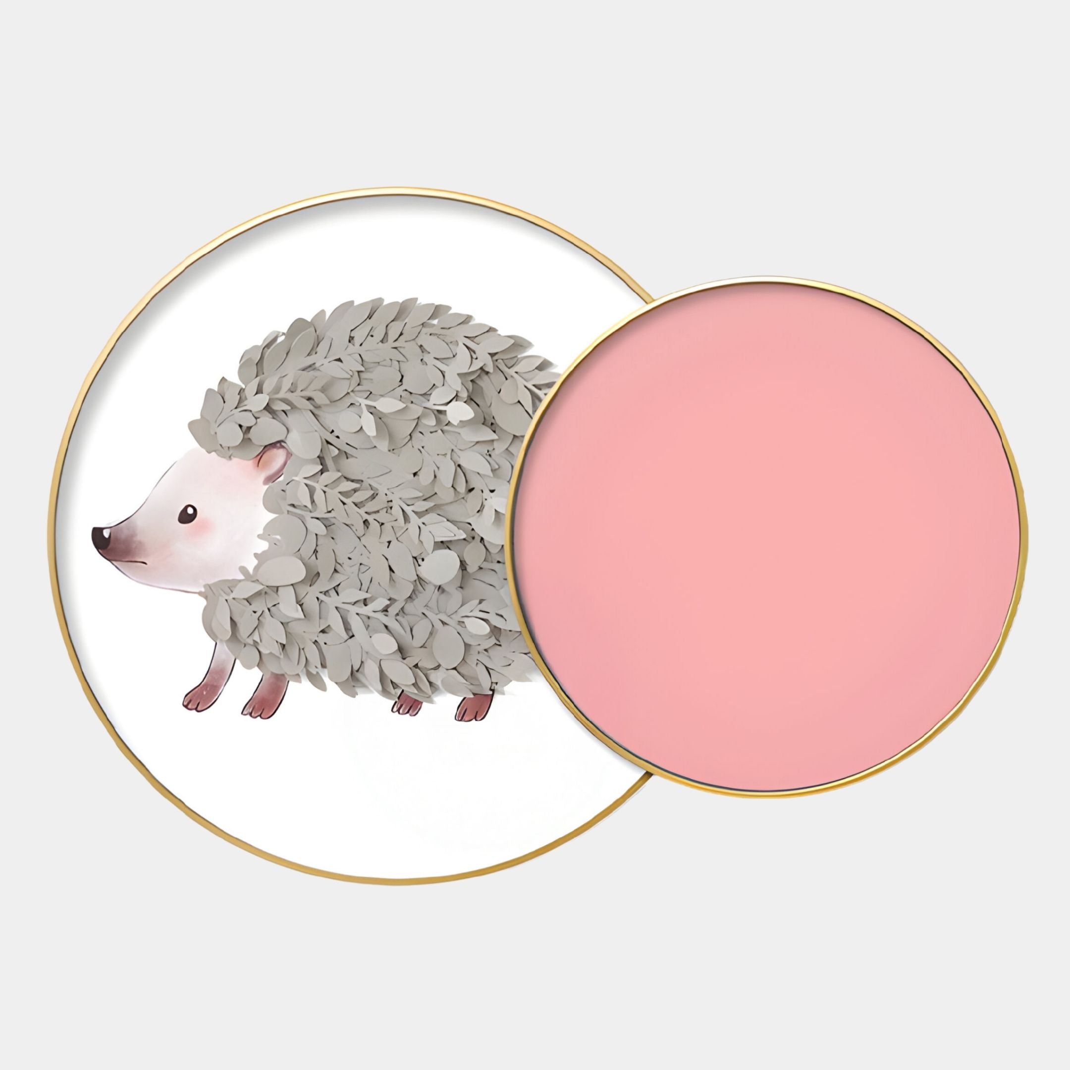 The Blossomkin Pink Petal Hedgehog Kids 3D Wall Art by Giant Sculptures features a leaf-quilled hedgehog on one plate and a solid pink plate, both with gold rims—ideal nursery wall decor.