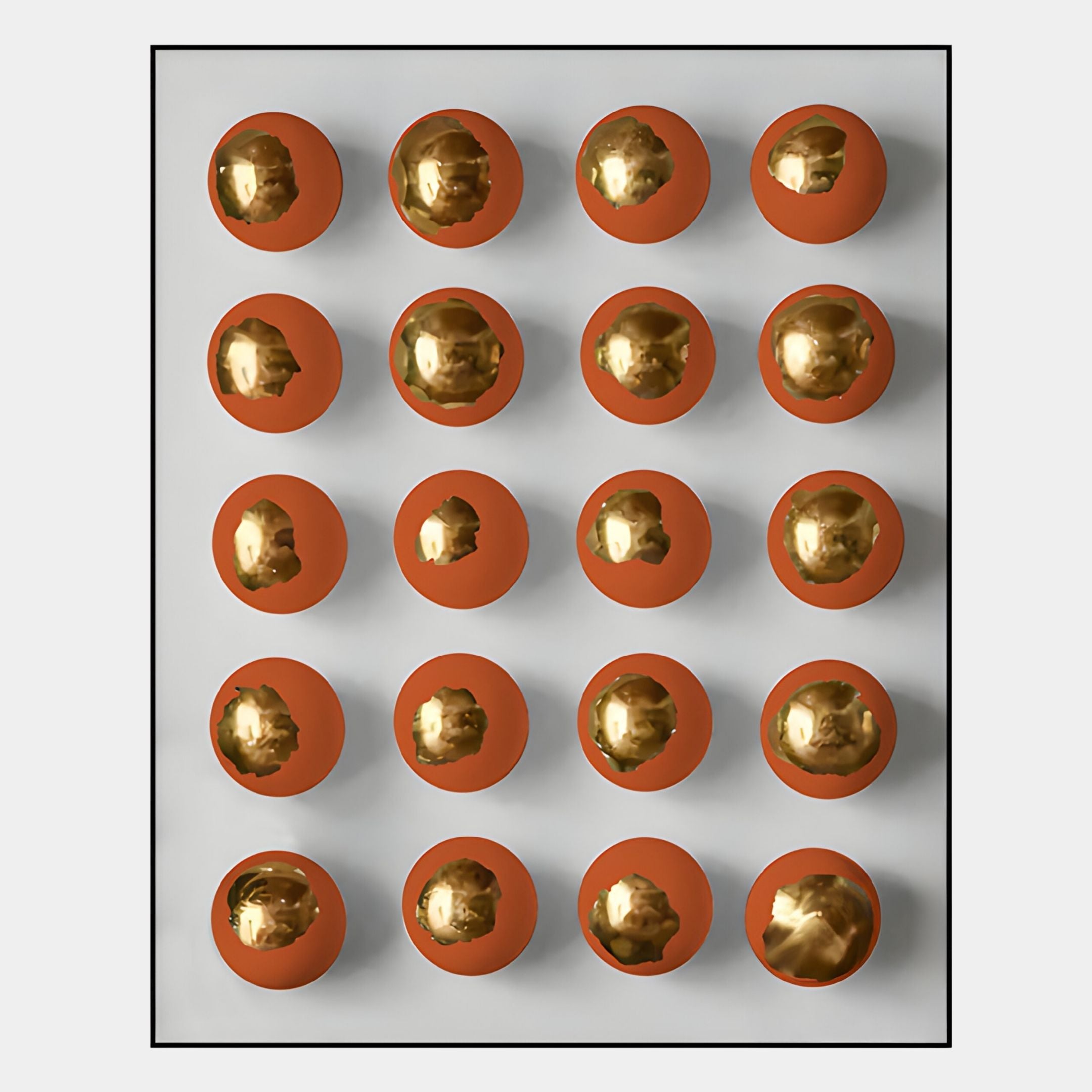 The Orbivelle Amber-Gold Patch Sphere & White Panel 3D Wall Art by Giant Sculptures features a Nordic-inspired grid of 20 amber-gold spheres, each above an orange shadow, arranged in four rows and five columns on a white background.
