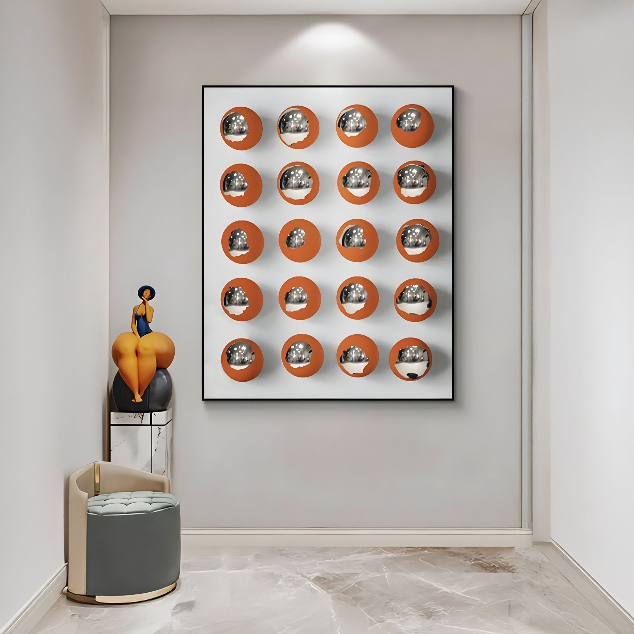 A modern hallway with marble floors showcases the Orbivelle Amber-Silver Patch Sphere & White Panel 3D Wall Art by Giant Sculptures, a small gray stool, and a decorative seated woman sculpture on a corner table.