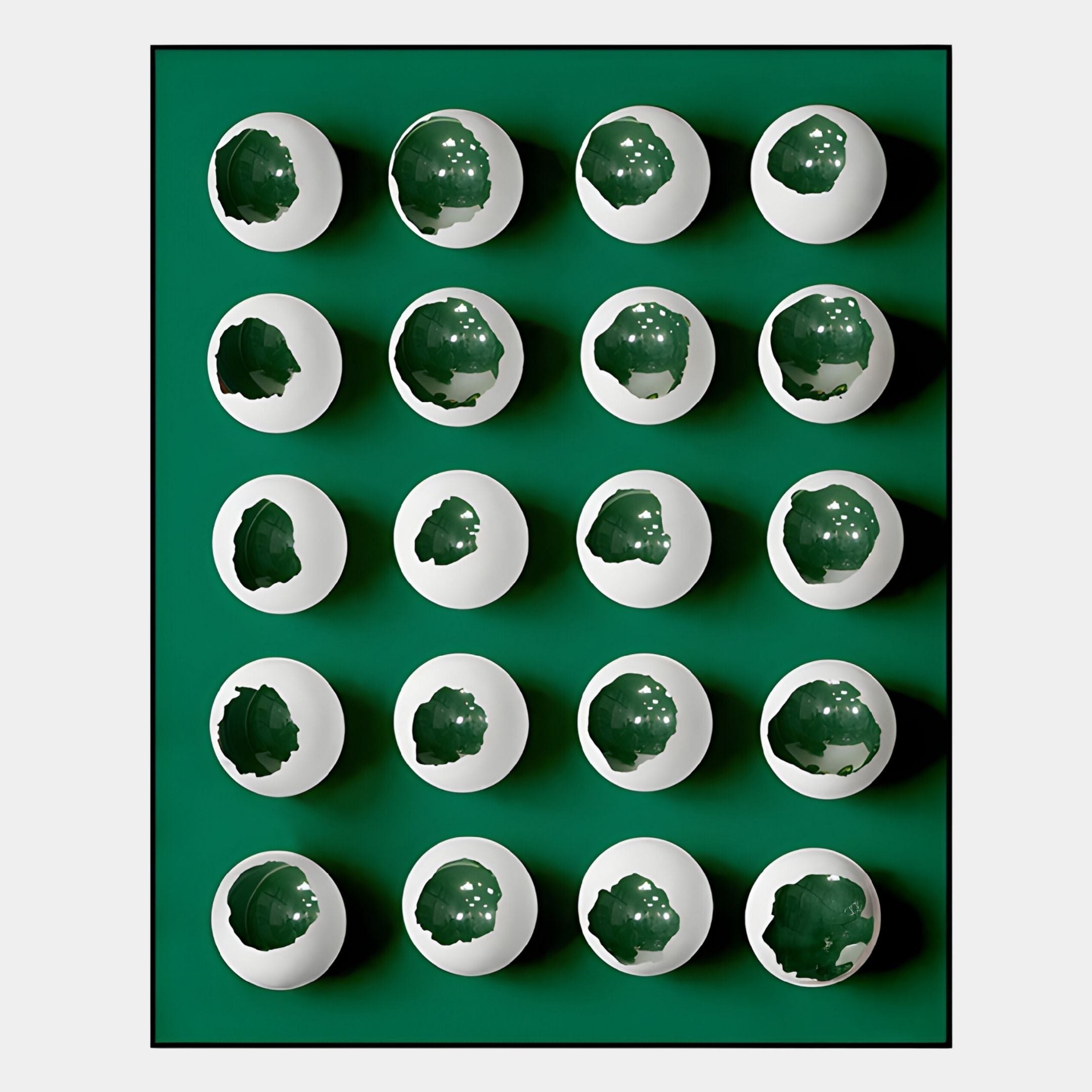 The Orbivelle White & Emerald Patch Sphere Panel 3D Wall Art by Giant Sculptures features twenty white eggshell-like forms with emerald interiors, arranged in a 5x5 grid for stunning modern wall decor.
