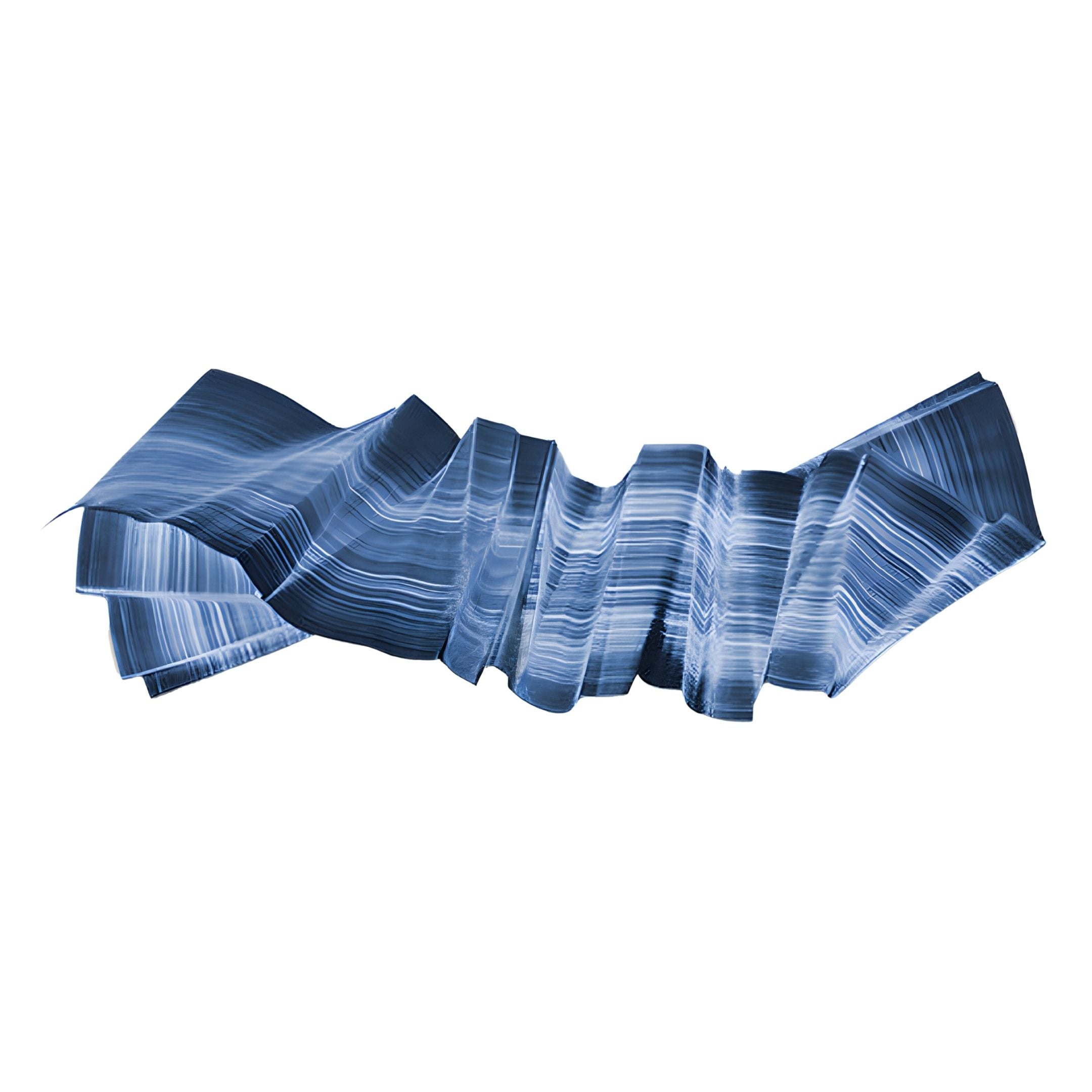 The Vellun Wave Deep Marine Sculptural 3D Wall Art by Giant Sculptures features an abstract, folded ribbon design with blue and white stripes, evoking marine art and creating a striking focal point on any plain white wall.