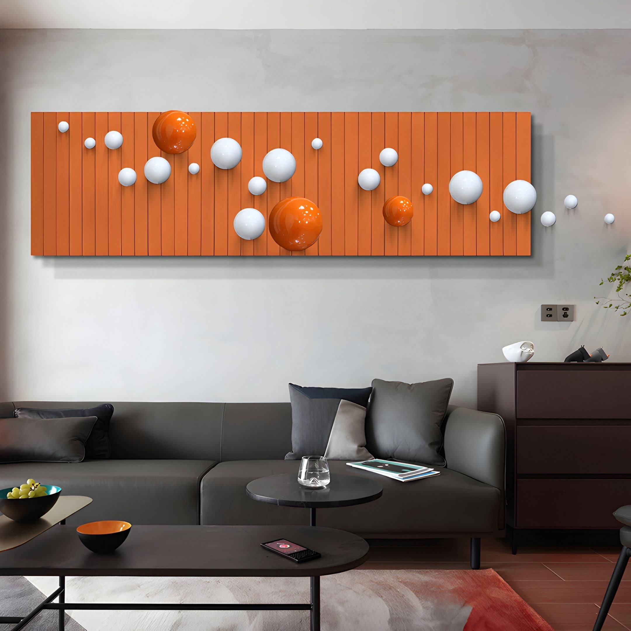 A modern living room with a gray sofa and minimalist decor features the Orbivance Orange & White Sphere Panel 3D Wall Art by Giant Sculptures above the sofa. A black coffee table and orange accents complete the stylish space.