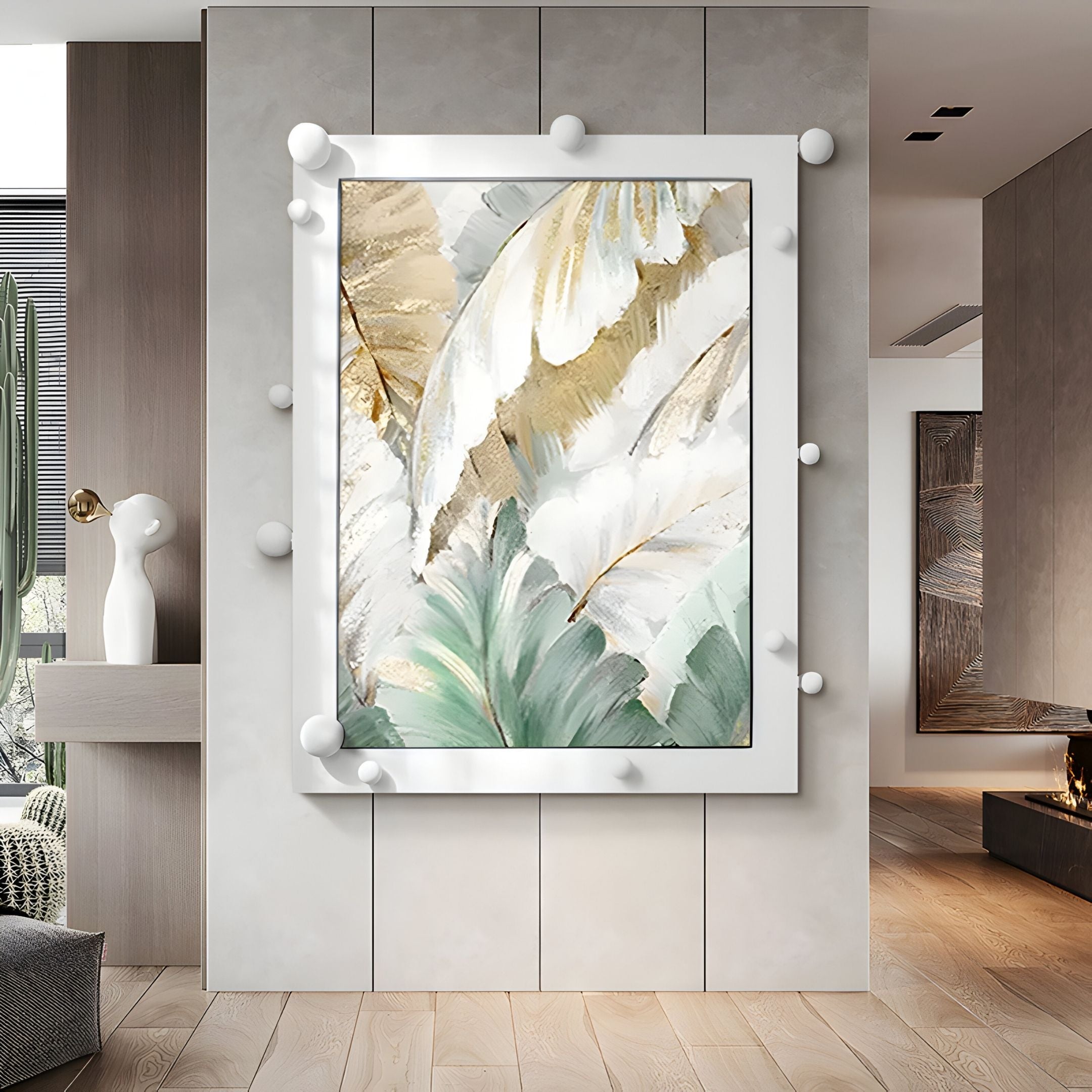The Verdantia II Green & Gold Leaf Textured 3D Wall Art by Giant Sculptures hangs on a modern light-gray paneled wall. Its white frame has spherical accents, while a cactus and minimalist sculpture enhance the stylish room.
