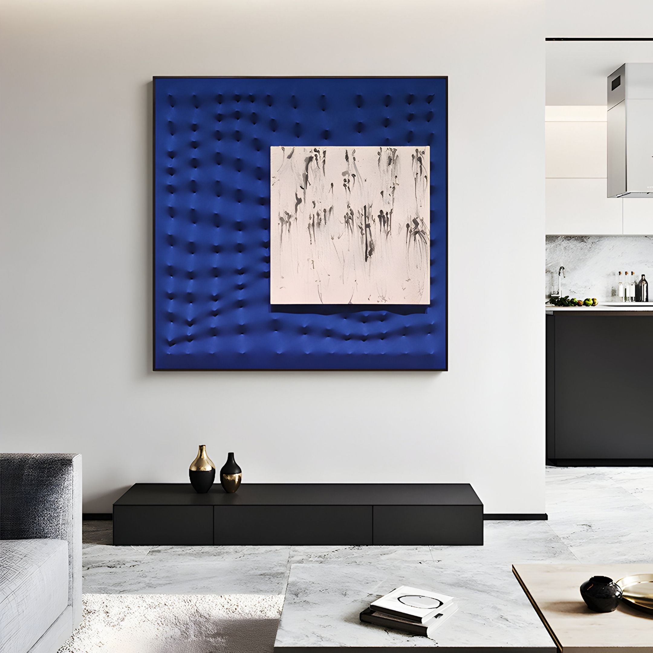 A minimalist white and gray living room features the Loftera Blue Sculpted Fabric & Abstract Canvas 3D Wall Art by Giant Sculptures above a black console with vases, highlighted by bold blue tones and an abstract black-and-white center painting.