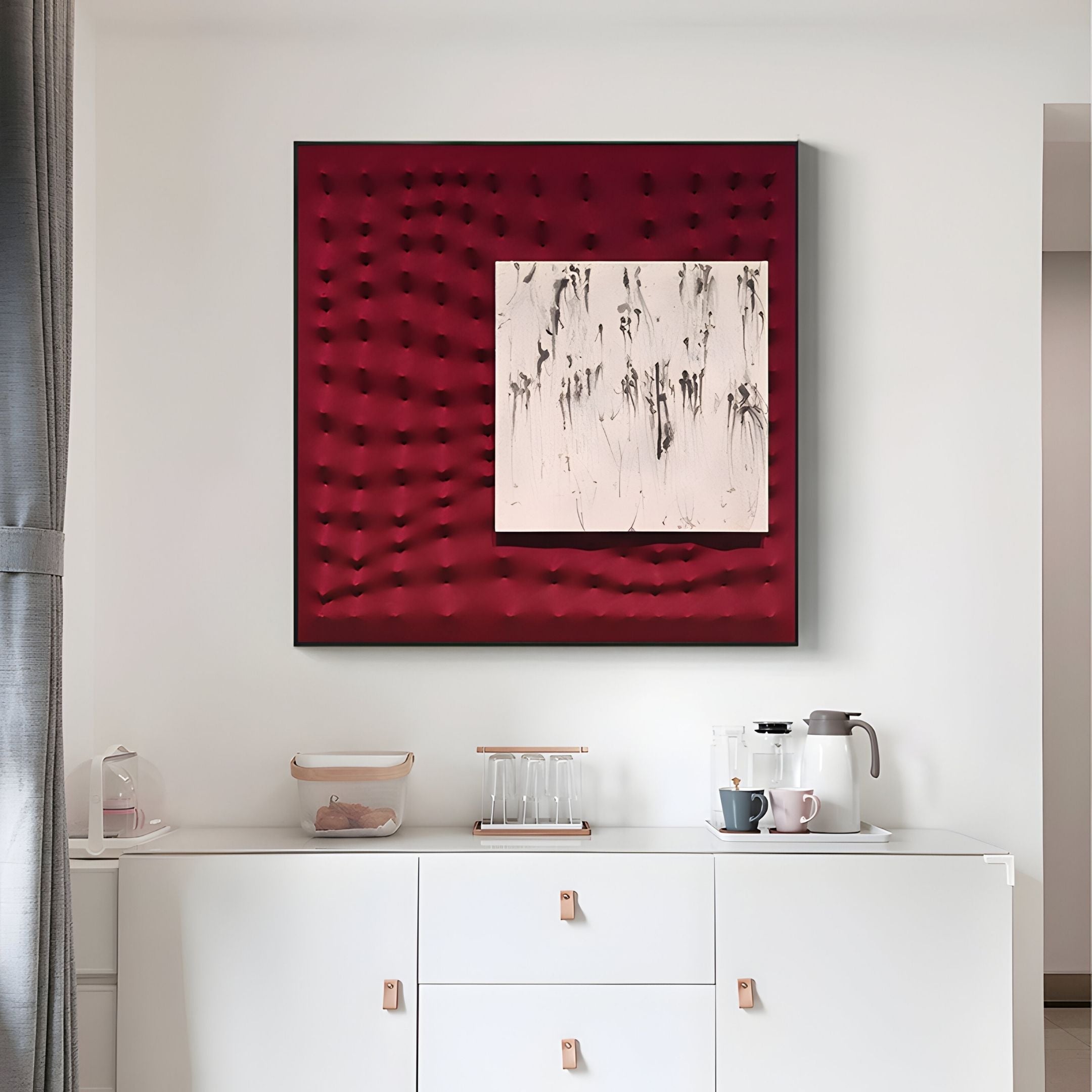 A modern white sideboard with a coffee setup sits below Giant Sculptures' Loftera Crimson Sculpted Fabric & Abstract Canvas 3D Wall Art, featuring red fabric protrusions and a central black-and-white abstract painting.