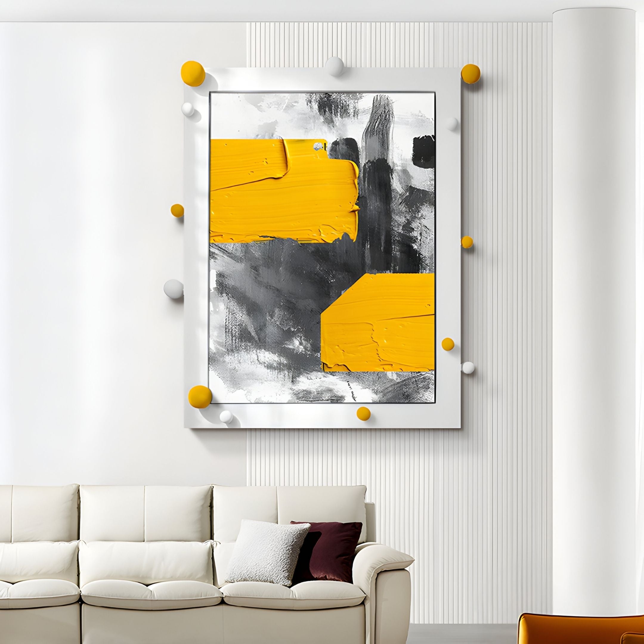 Vivexa Yellow & Grey Stroke Abstract 3D Wall Art by Giant Sculptures features bold yellow rectangles and black strokes on white, framed with round yellow and white accents—a striking modern decor piece for above a white sofa.