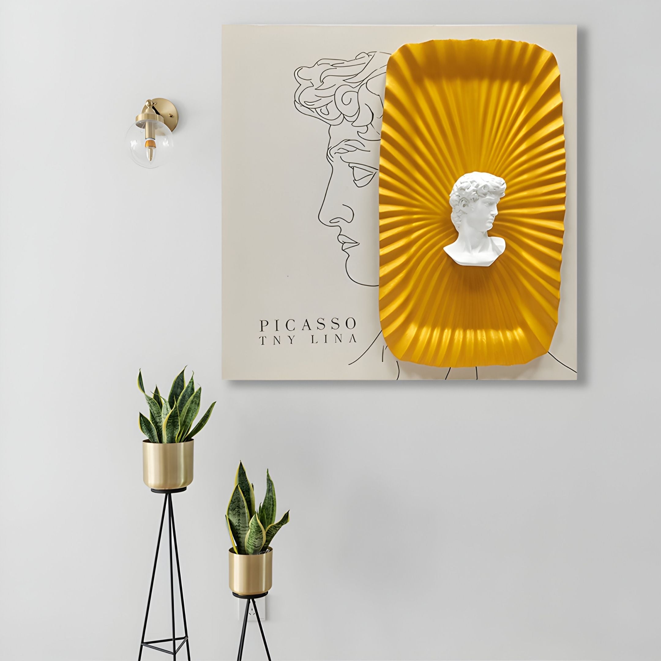 Castellune Gold Radiant Classical Bust 3D Wall Art by Giant Sculptures showcases a white classical bust in a yellow frame. Flanked by gold plant stands and a wall sconce, it creates a striking modern décor statement.