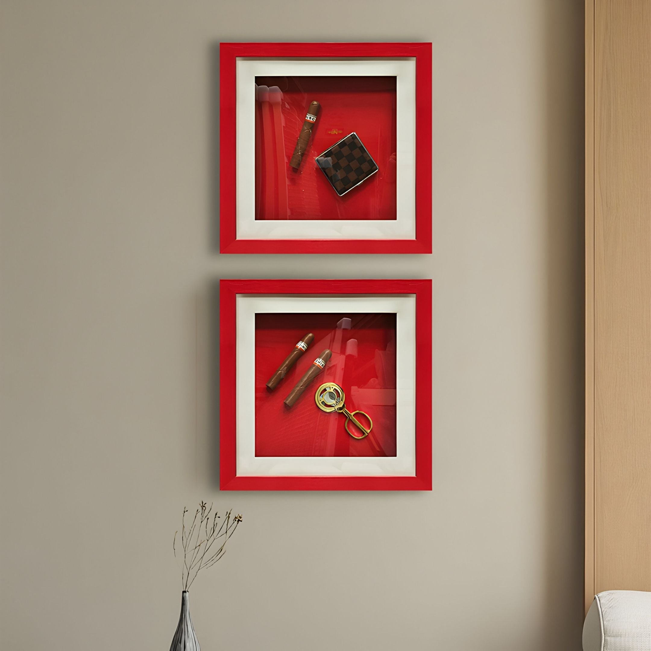 Two square Cavendro Twin Cigars & Brass Cutter Framed Wall Art by Giant Sculptures hang on a beige wall, each displaying vintage cigars and a brass cutter against a bold red background.