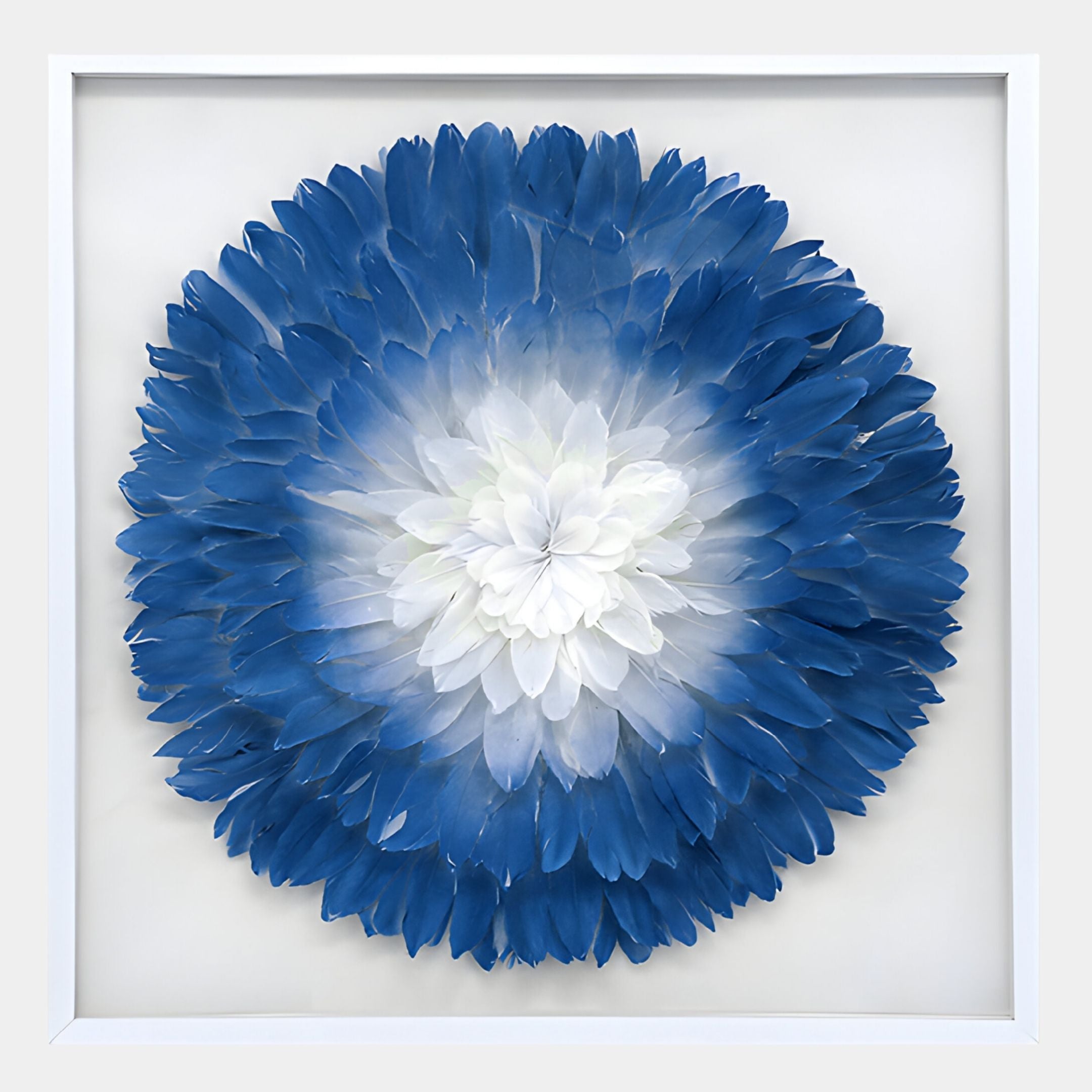 The Plumesse Deep Blue Bloom Layered Feather 3D Wall Art by Giant Sculptures displays an elegant circular design, featuring white to deep blue feather petals for a stunning effect against a white background.