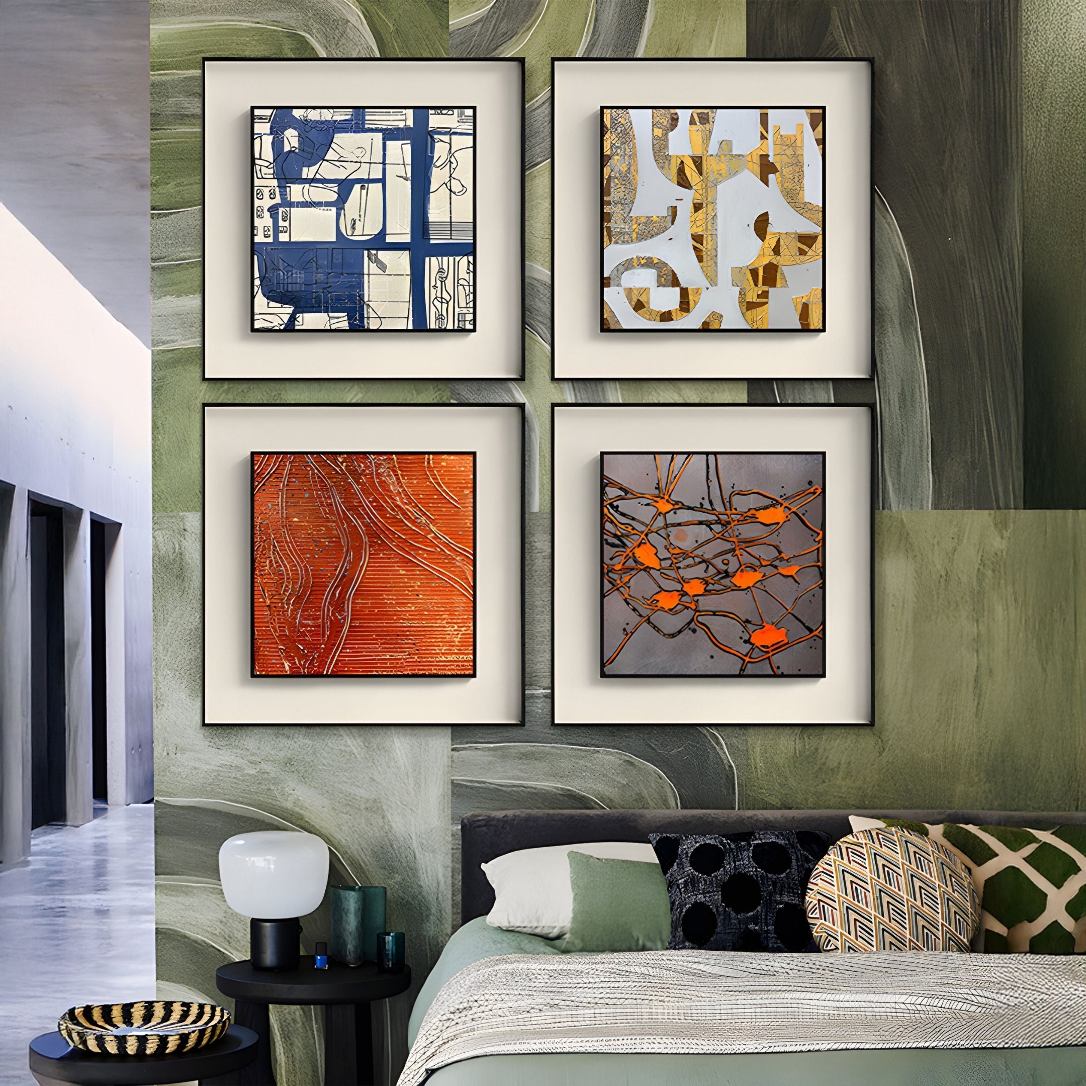 A modern bedroom boasts a green abstract mural, a bed with patterned pillows, and four Stratonis Blue & Beige Grid Abstract Textured Framed Wall Art pieces by Giant Sculptures displayed above the headboard.