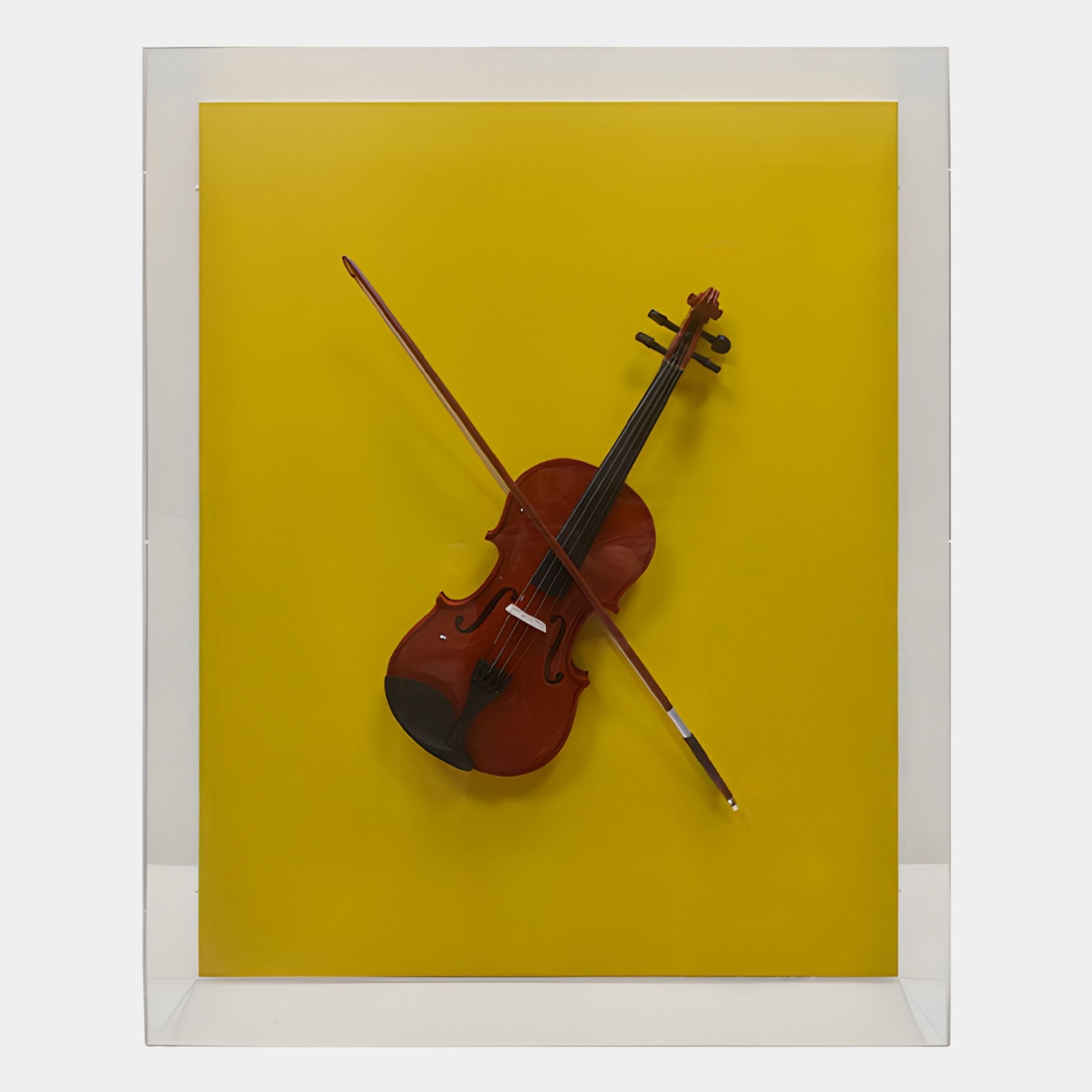 The Archetto Yellow Violin Acrylic Framed 3D Wall Art by Giant Sculptures features a violin and bow in an X shape on a vivid yellow background, encased in a clear rectangular frame—a bold, modern decor piece.