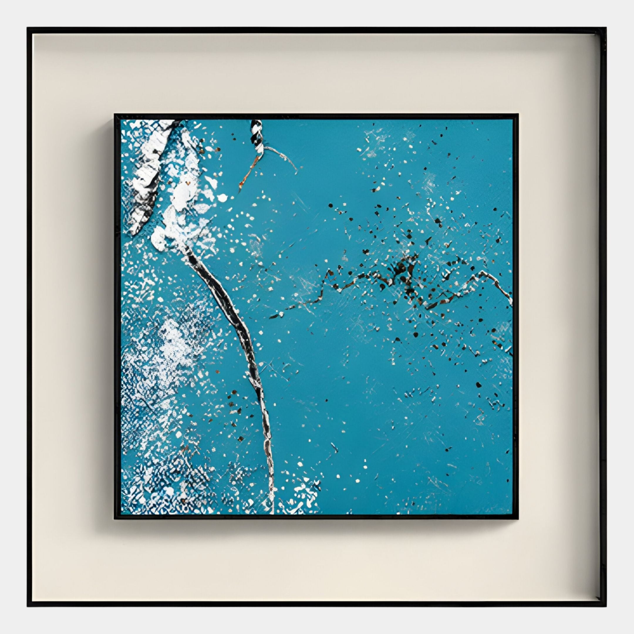 The Trevasse Aqua Blue Textured Abstract Framed Wall Art by Giant Sculptures features a teal blue background with white splashes, black speckles, and silver streaks in a black shadow box frame displayed on a light beige wall.
