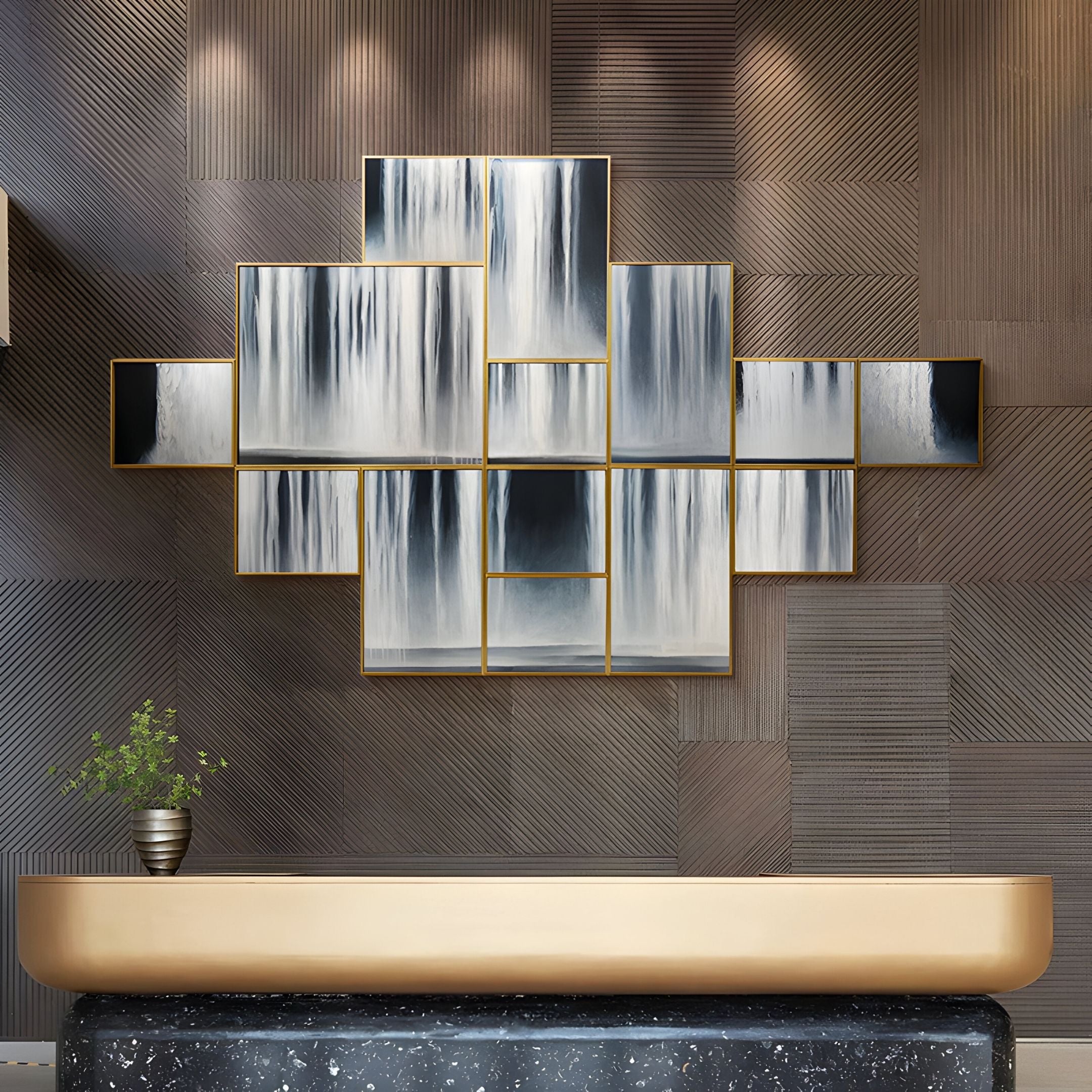 A modern interior features Giant Sculptures’ Auresmap Silver Cascade Multi-Panel Waterfall Wall Art above a tan and black reception desk with a small striped plant pot, set against textured brown wall panels.