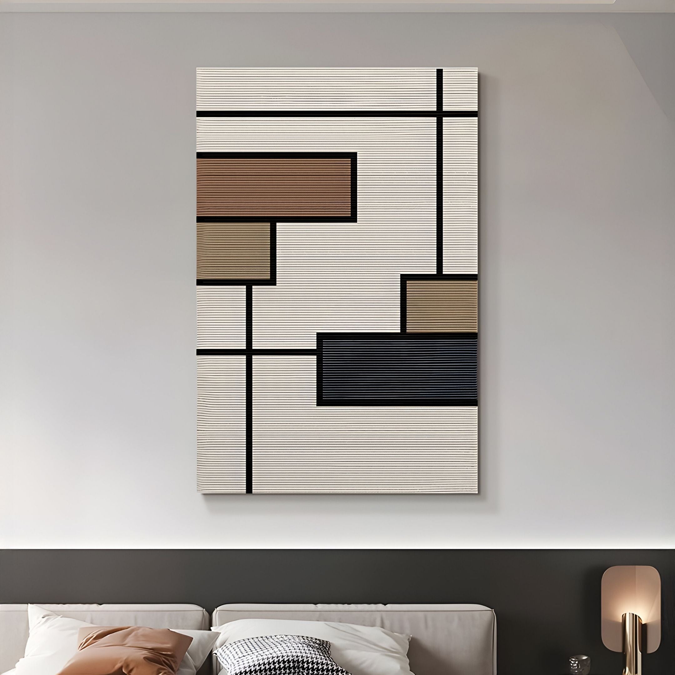 The Gridoria Mocha & Charcoal Linear Block Woven Wall Art by Giant Sculptures, featuring geometric rectangles in brown, tan, black, and navy on a textured cream background, hangs above a modern sofa in a neutral-toned living room.