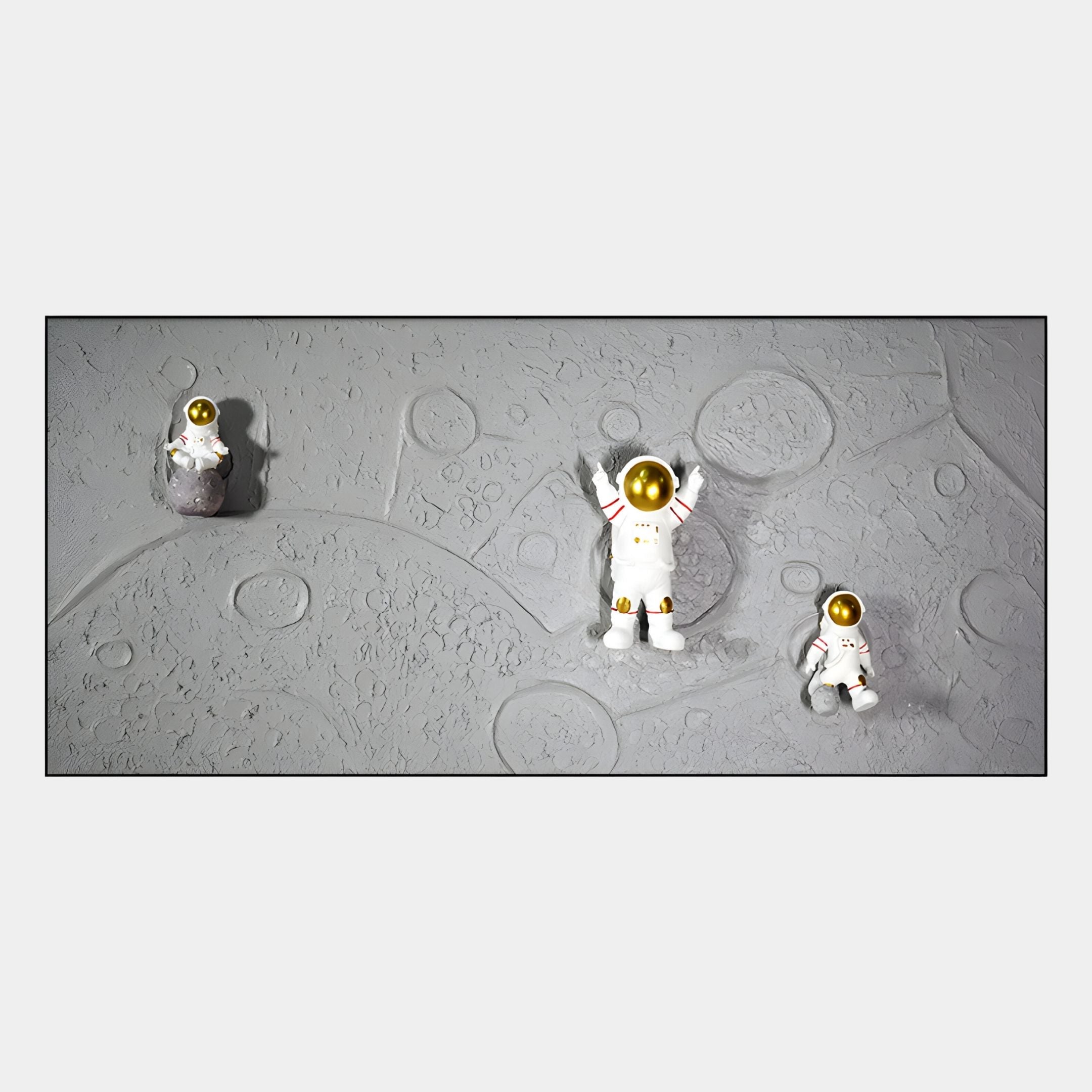 The Astravera Lunar Crew Grey Textured Astronaut 3D Wall Art by Giant Sculptures features three small astronauts with gold visors on a cratered moon surface, perfect for kids’ rooms or space-themed decor.