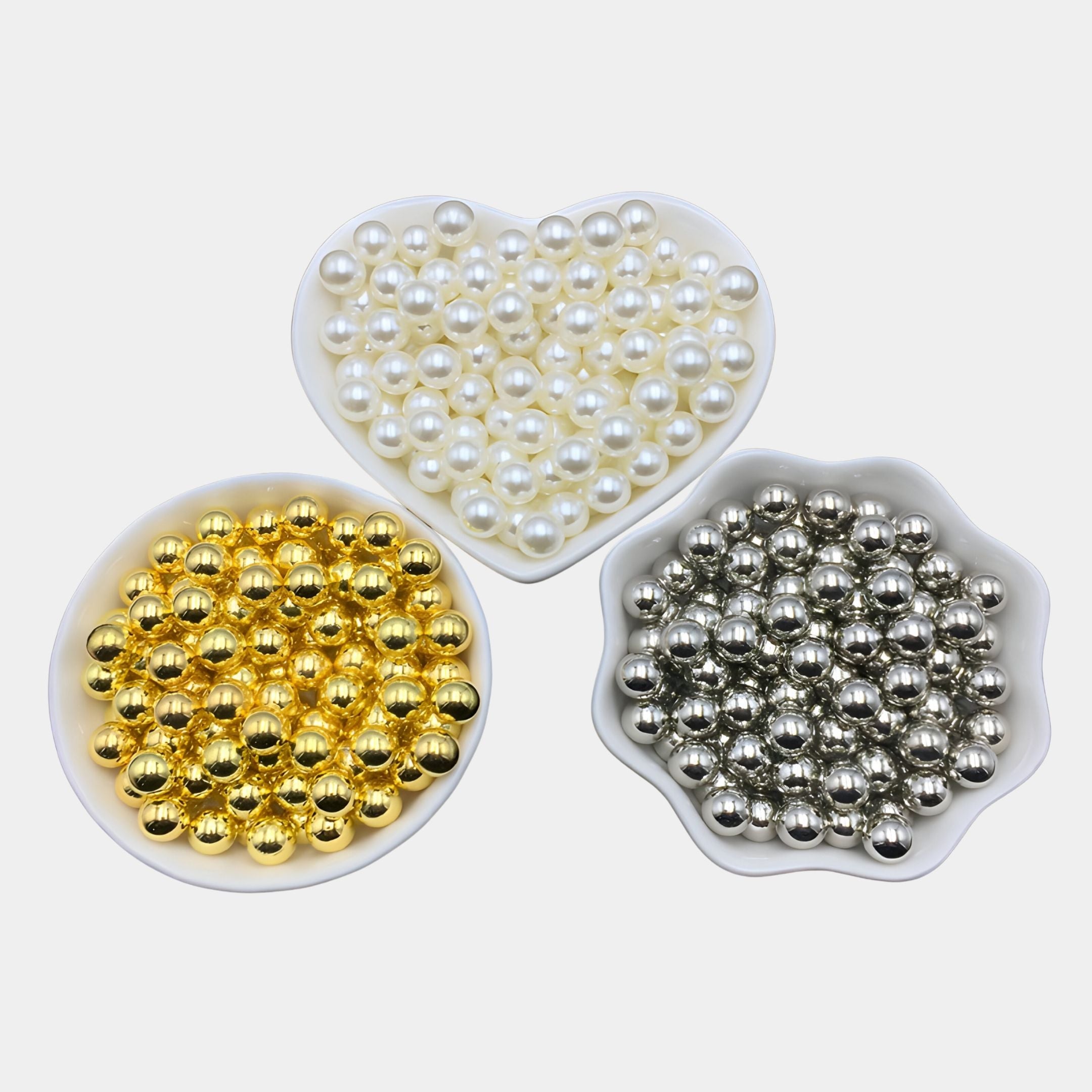 The Auravolta IV Pearl Beads Swirl Pattern 3D Wall Art by Giant Sculptures features white, gold, and silver beads—ideal for creating unique 3D wall art or adding elegant accents to swirl patterns on a white background.