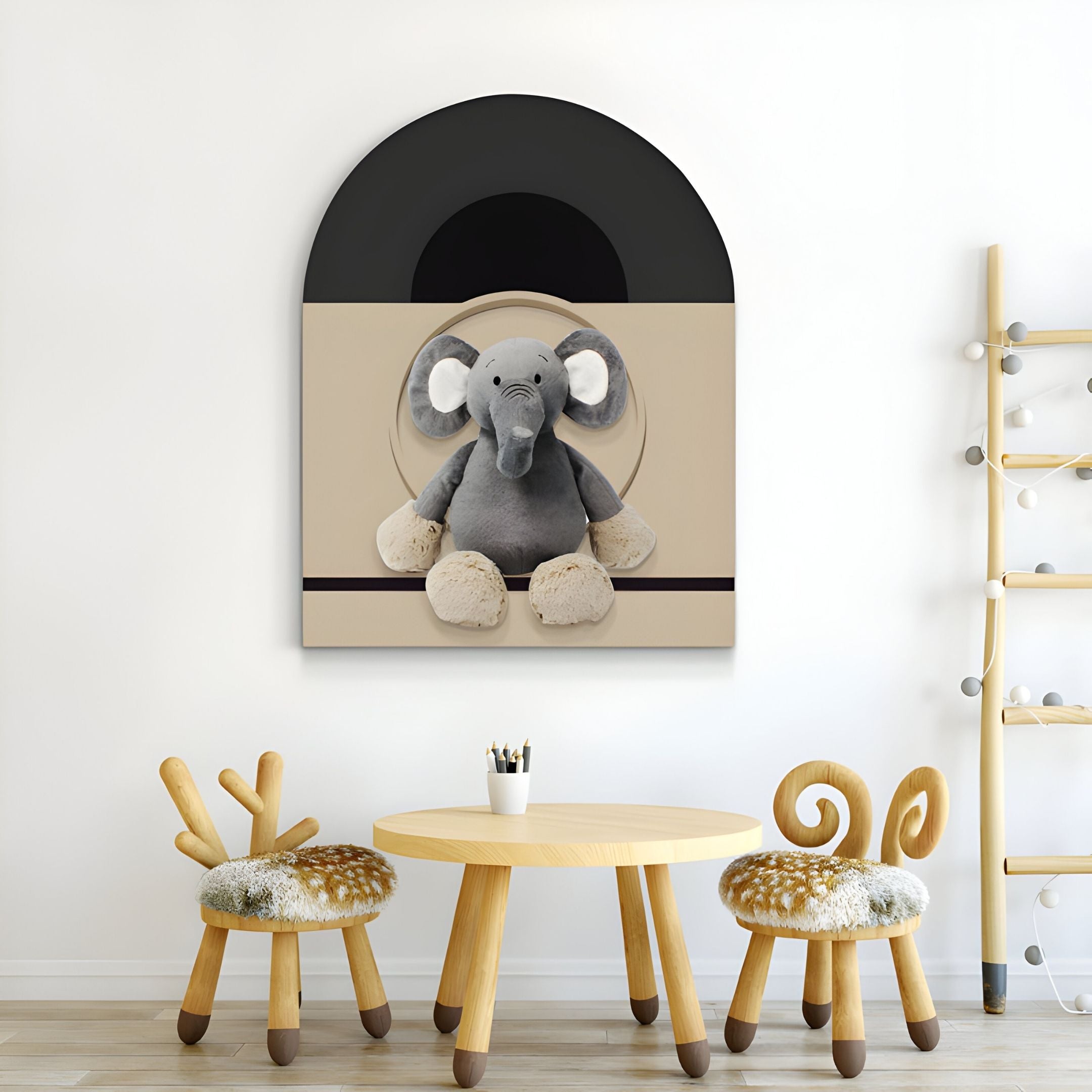 A children’s play area with a round wooden table, two animal-shaped chairs, a ladder shelf, and the Cuddiloft Elephant Plush Display 3D Wall Art by Giant Sculptures adds playful, minimalistic decor to the room.