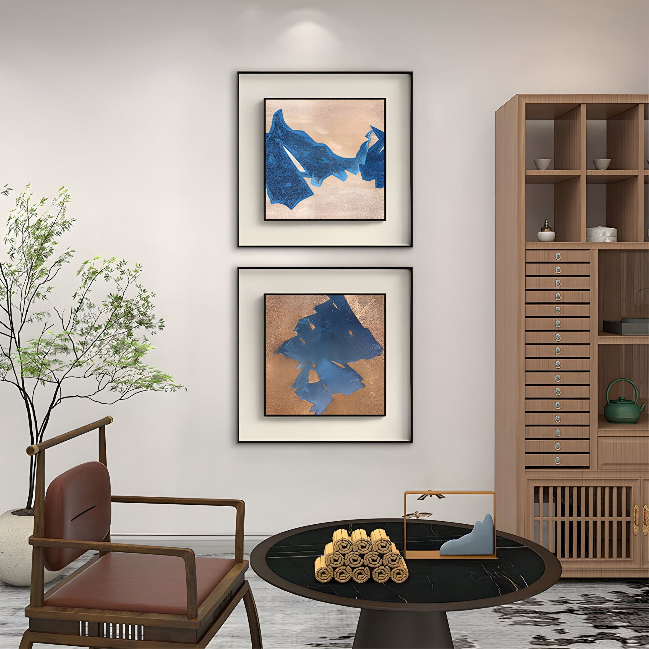 A modern living room features a wooden chair, black round coffee table, bamboo cabinet, and Giant Sculptures' Stratum Indigo Drift Textured Abstract Framed Wall Art above a green potted plant—ideal for contemporary decor lovers.