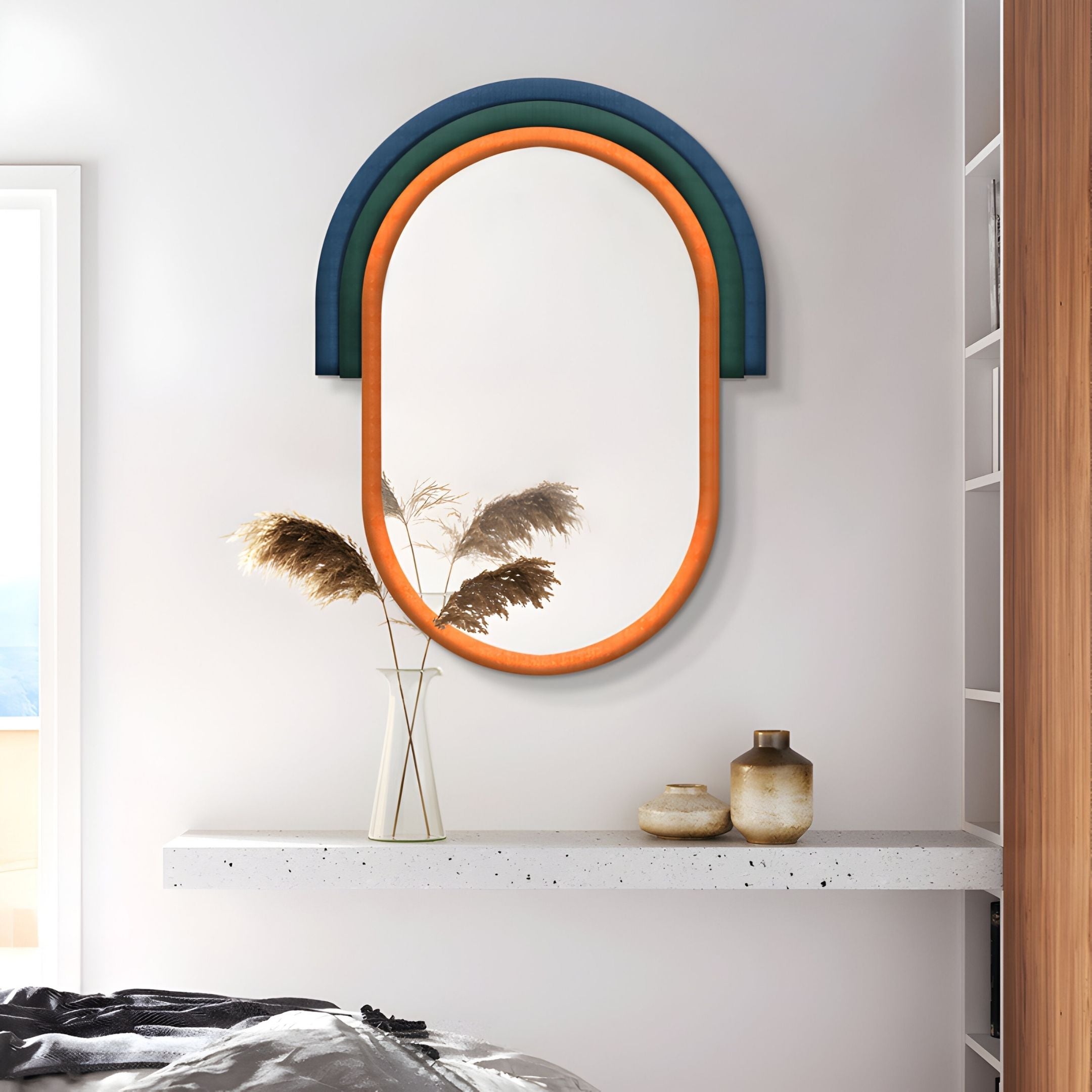 The Arcaluna Blue & Orange Layered Arch Mirror 3D Wall Art by Giant Sculptures adds striking, modern style above a floating white shelf with decor, perfect for minimalist homes.