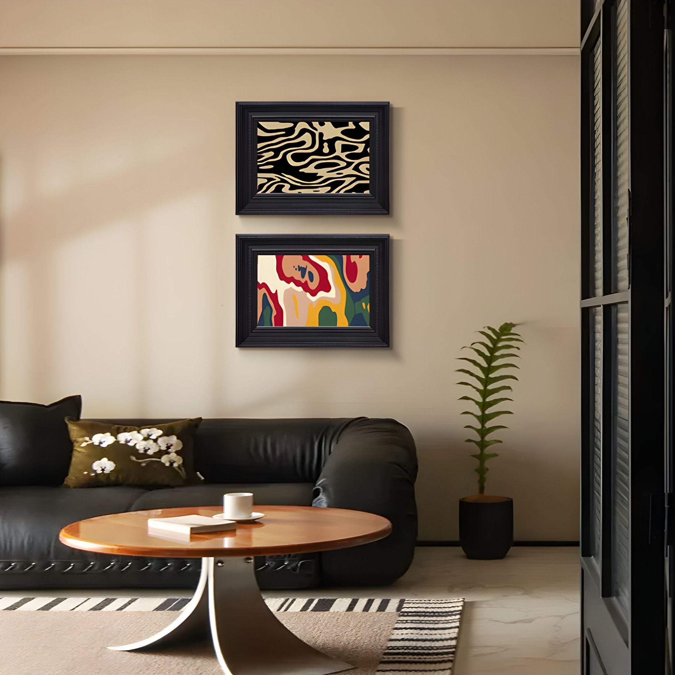 A modern living room features a black sofa, round wooden coffee table, potted plant, and the Ardensir Multicolour Abstract 2-Set Framed Wall Art by Giant Sculptures on a beige wall. A striped rug is spread across the floor.