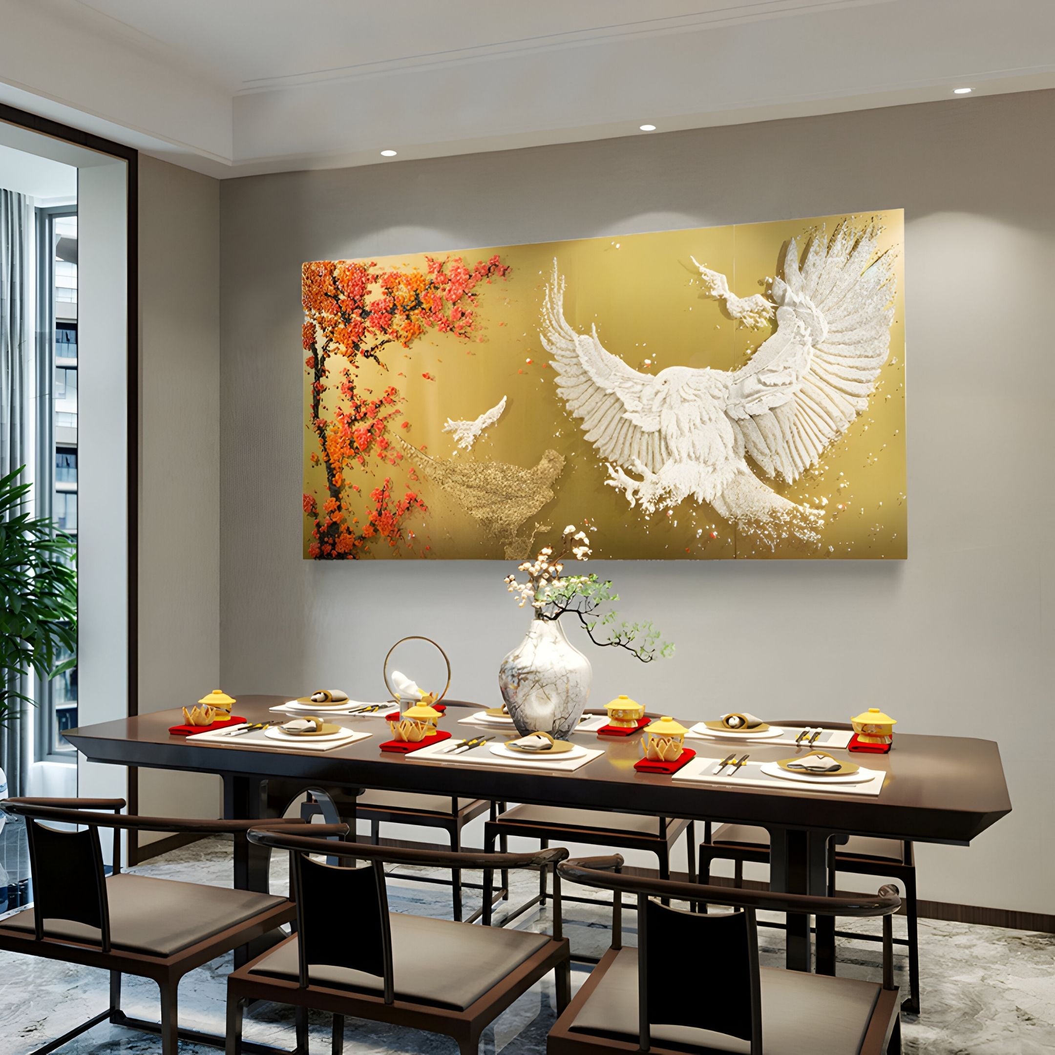 A modern dining room features a long table for six, centered by a vase of white flowers and highlighted by Giant Sculptures' Aurellion White Birds & Red Blossom Gold Panel 3D Button Wall Art. The elegant gold panels create a striking focal point.