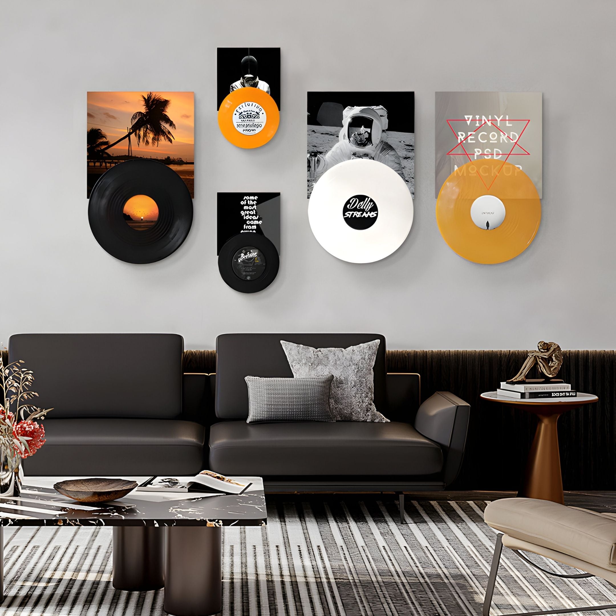 A modern living room features a black sofa, cushions, marble coffee table, and Giant Sculptures' Vinylora Sunset & Space Vinyl Records 5-Panel Wall Art above the seating area, adding striking music-themed decor.