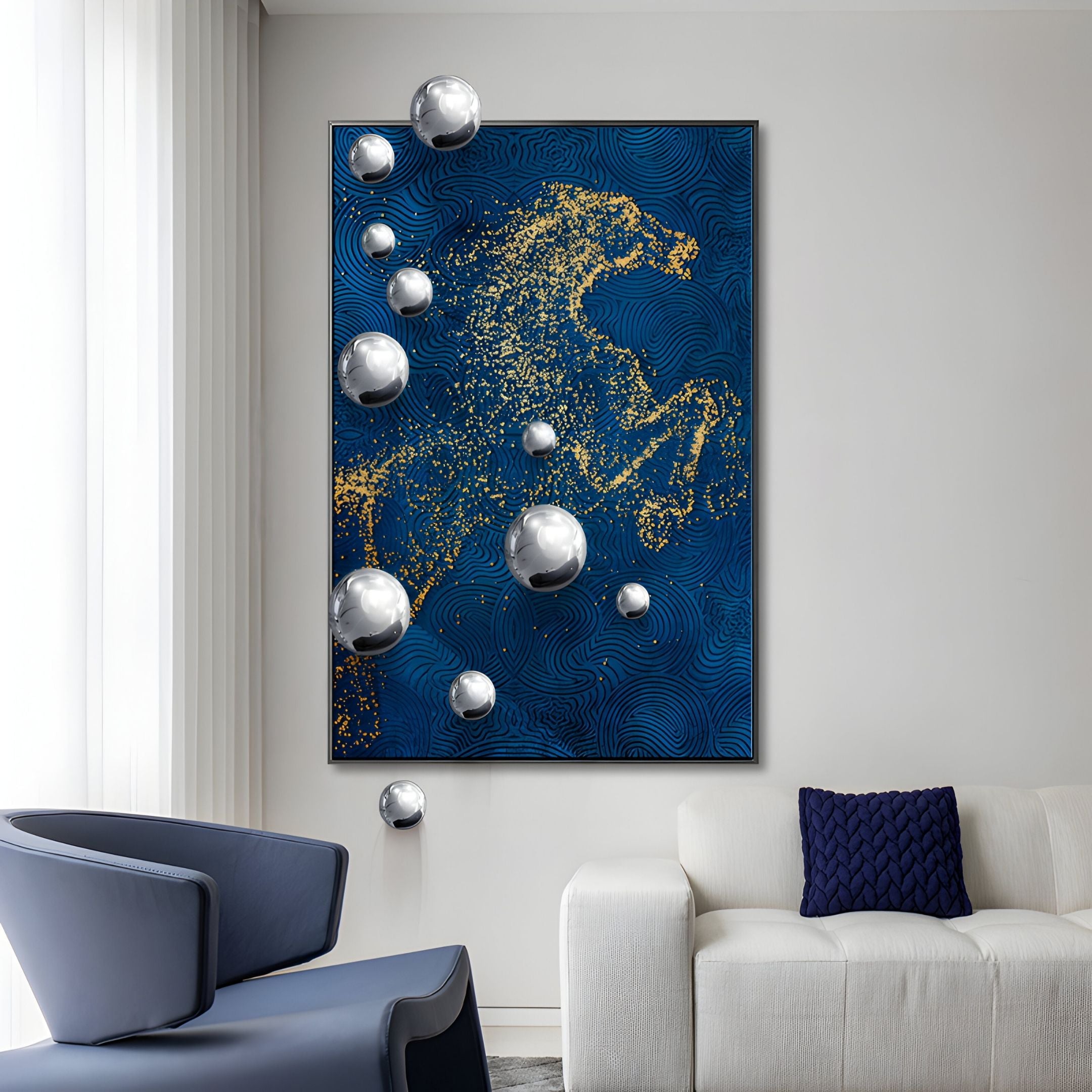 A modern living room with a white sofa, blue chair, and the AstraLuxe Blue & Gold 3D Wall Art With Metal Balls by Giant Sculptures, featuring metallic silver spheres extending from the art onto the wall for a striking contemporary look.