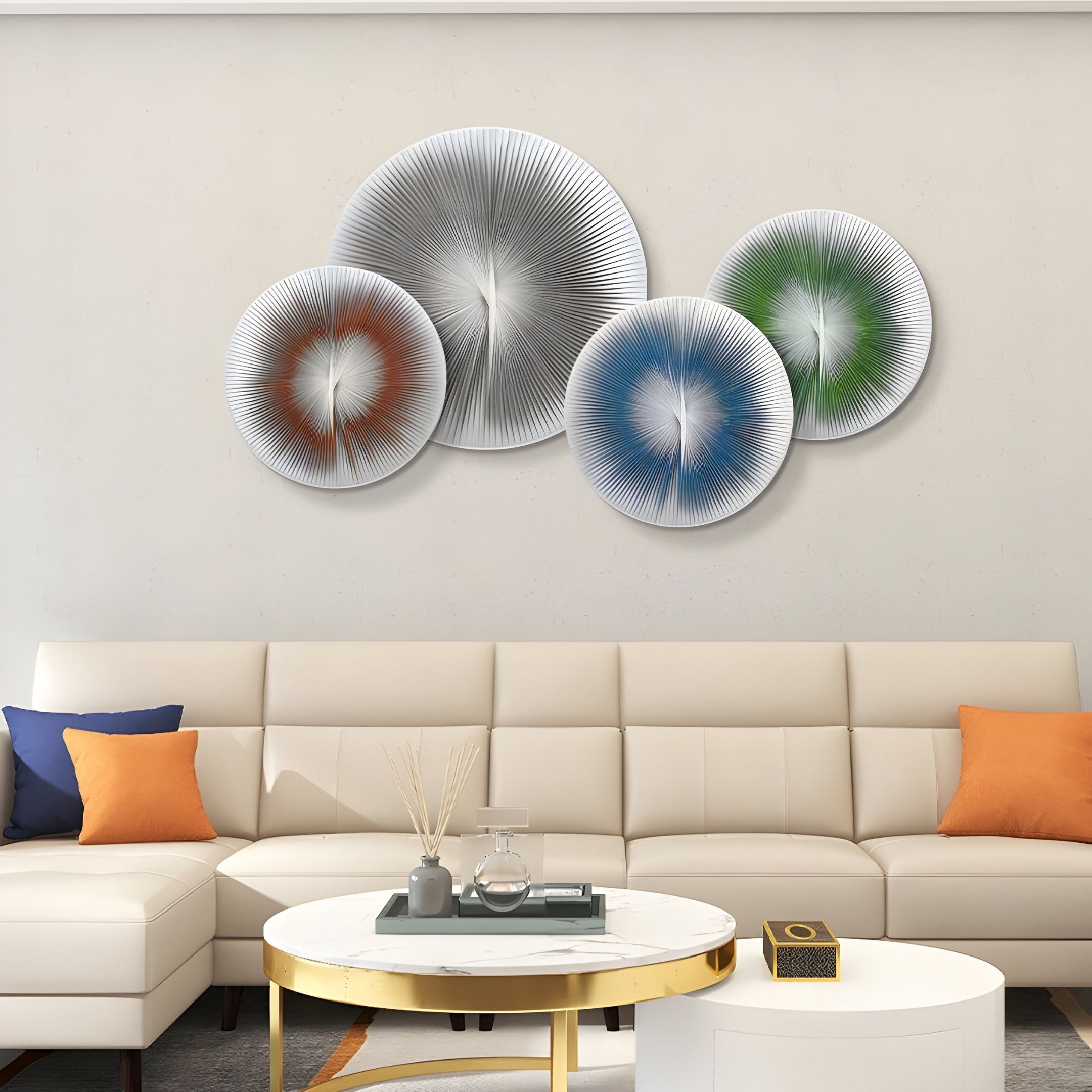 A modern living room with a white sofa, colorful pillows, and a round coffee table showcases the Centria Multicolour Disc 4-Panel 3D Leather Wall Art by Giant Sculptures, featuring abstract metallic circles in silver, blue, green, and orange.