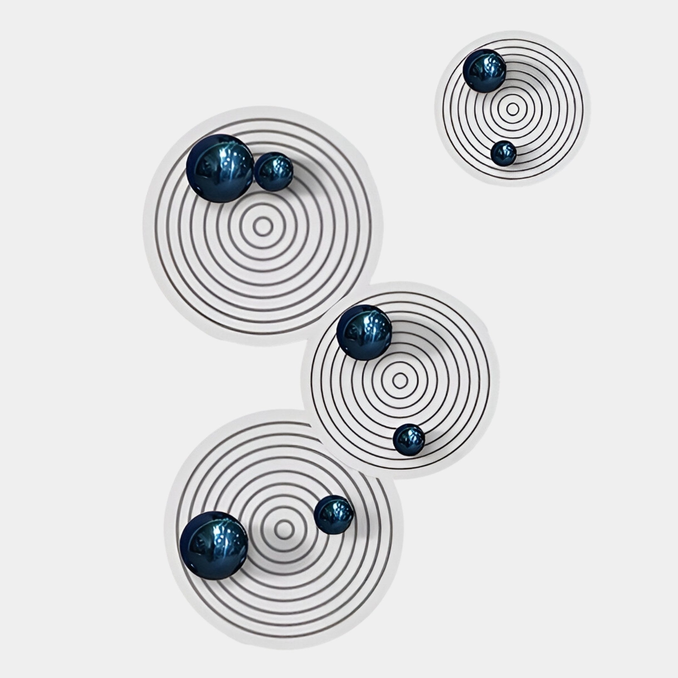 The Orbiora Blue Orb 4-Panel Concentric Sphere 3D Wall Art by Giant Sculptures features glossy blue spheres set in black concentric circles on a white background, creating a bold, modern look with dynamic depth and contrast.