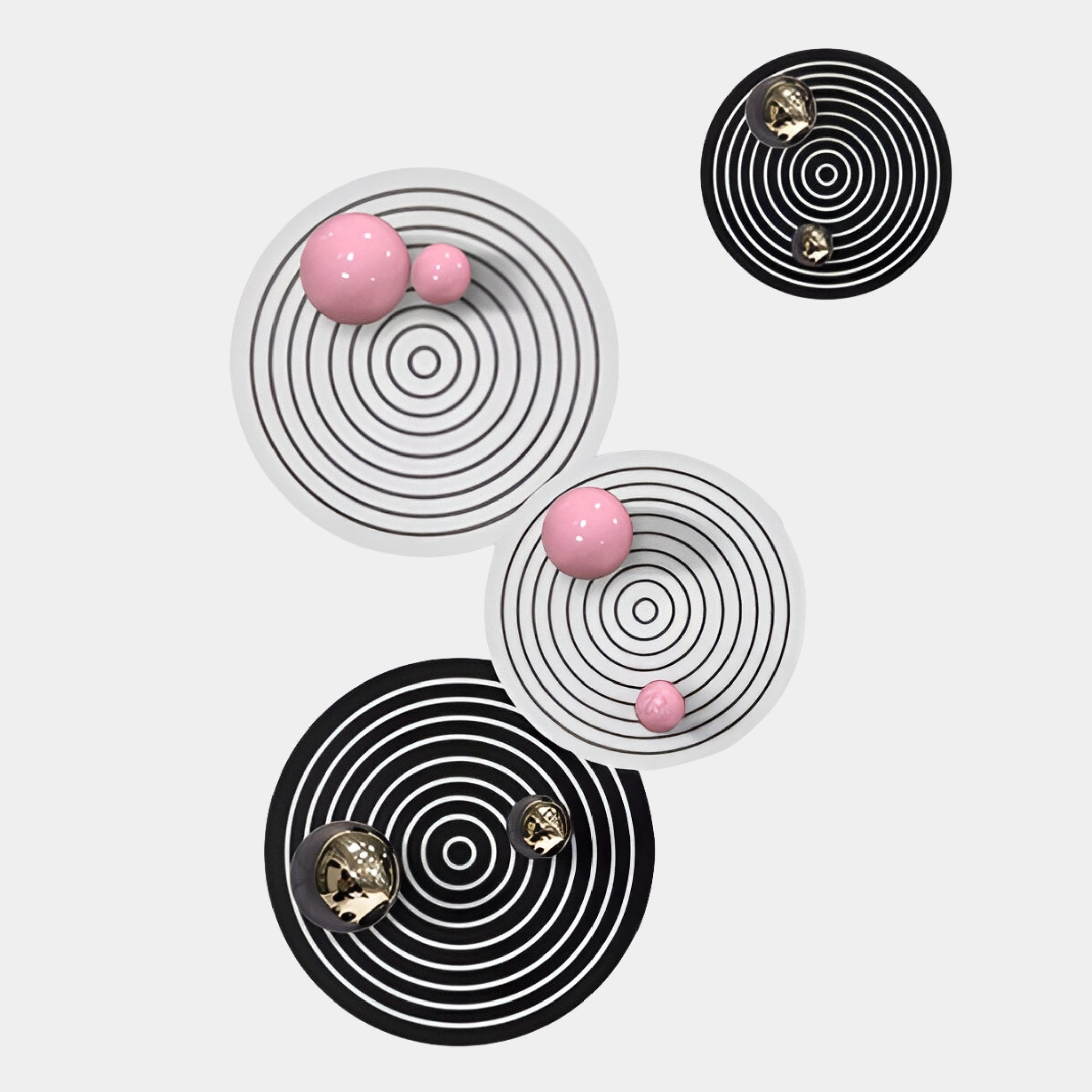 The Orbiora Pink & Gold Orb 4-Panel Concentric Sphere 3D Wall Art by Giant Sculptures features glossy pink and gold spheres on black and white rings for a modern touch, making it the perfect contemporary wall art accent.