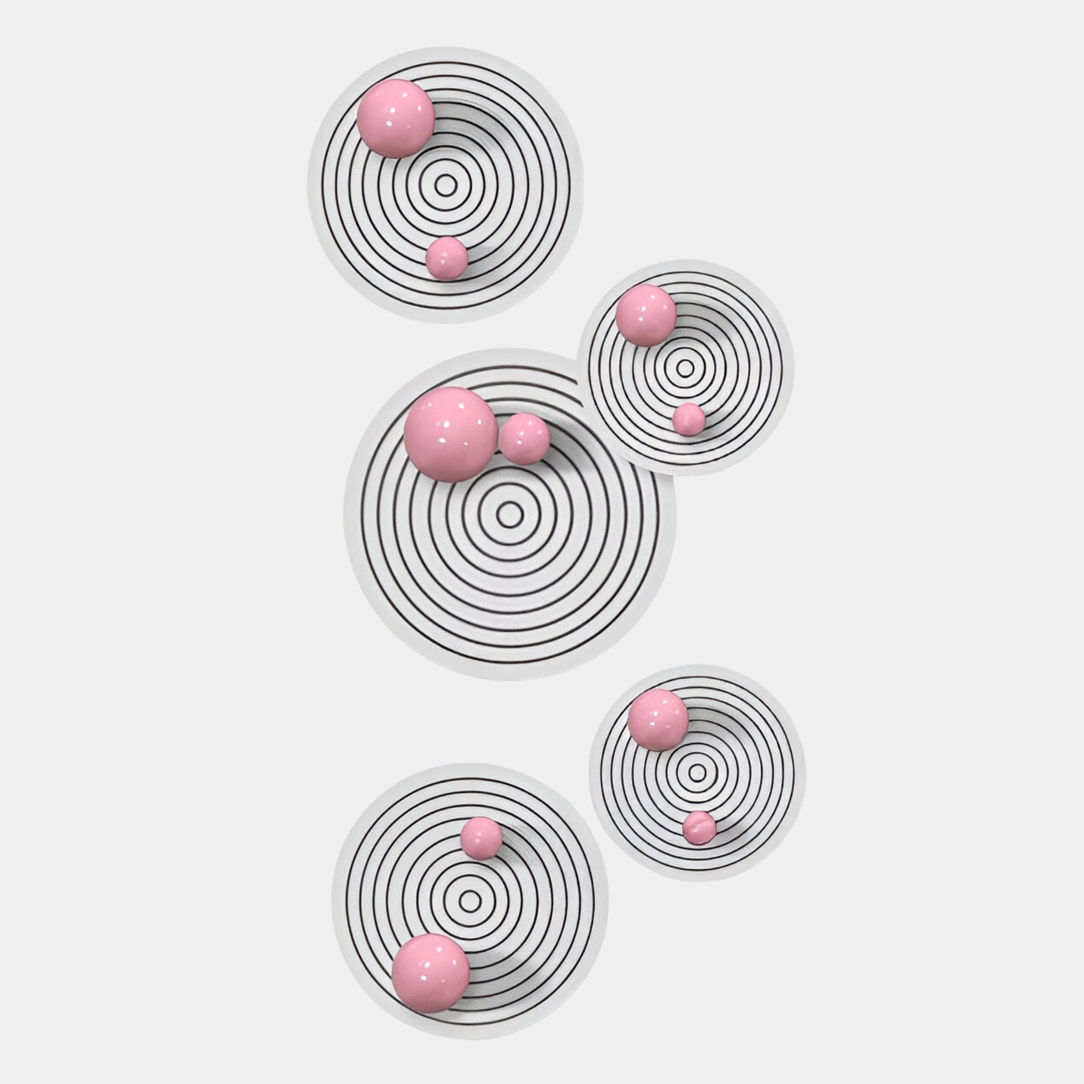 The Orbiora Pink Orb 5-Panel Concentric Sphere 3D Wall Art by Giant Sculptures features five white targets with black rings and shiny pink spheres, arranged vertically—ideal as modern wall decor or striking 3D wall art.